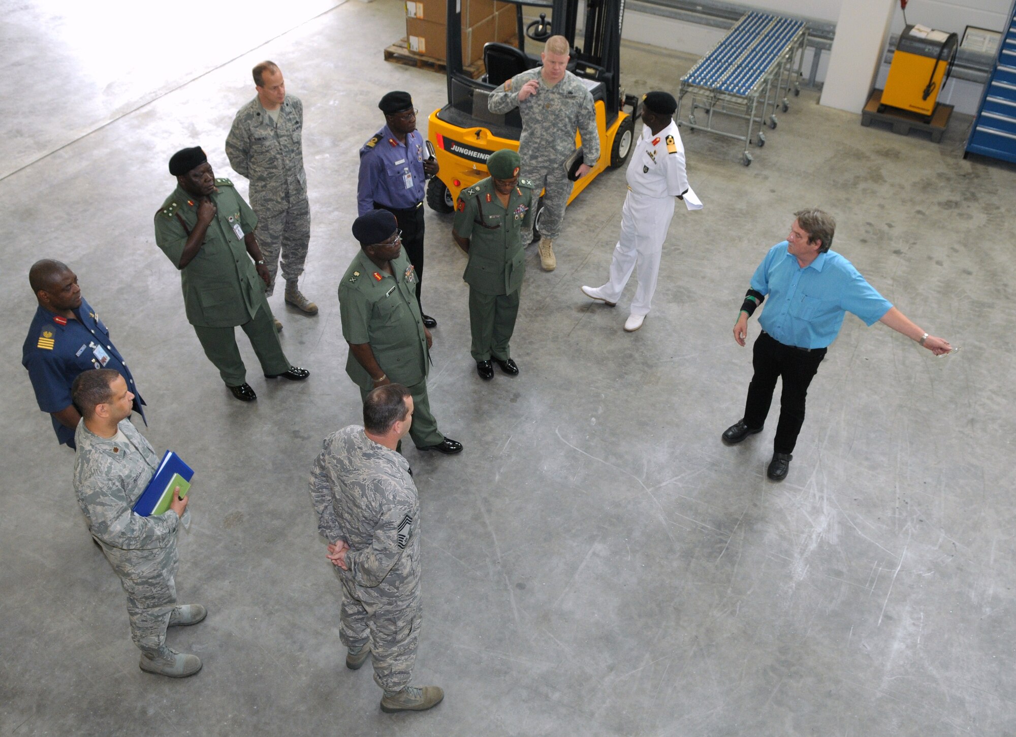 Mr. Ed Juko (left), Chief of Operations for Materiel Management at the 86th Logistics Readiness Group, shows the LRG's parts warehouse to a visiting delegation of Nigerian defense officials Sept. 11 at Ramstein. (USAF photo by Master Sgt. Jim Fisher) 