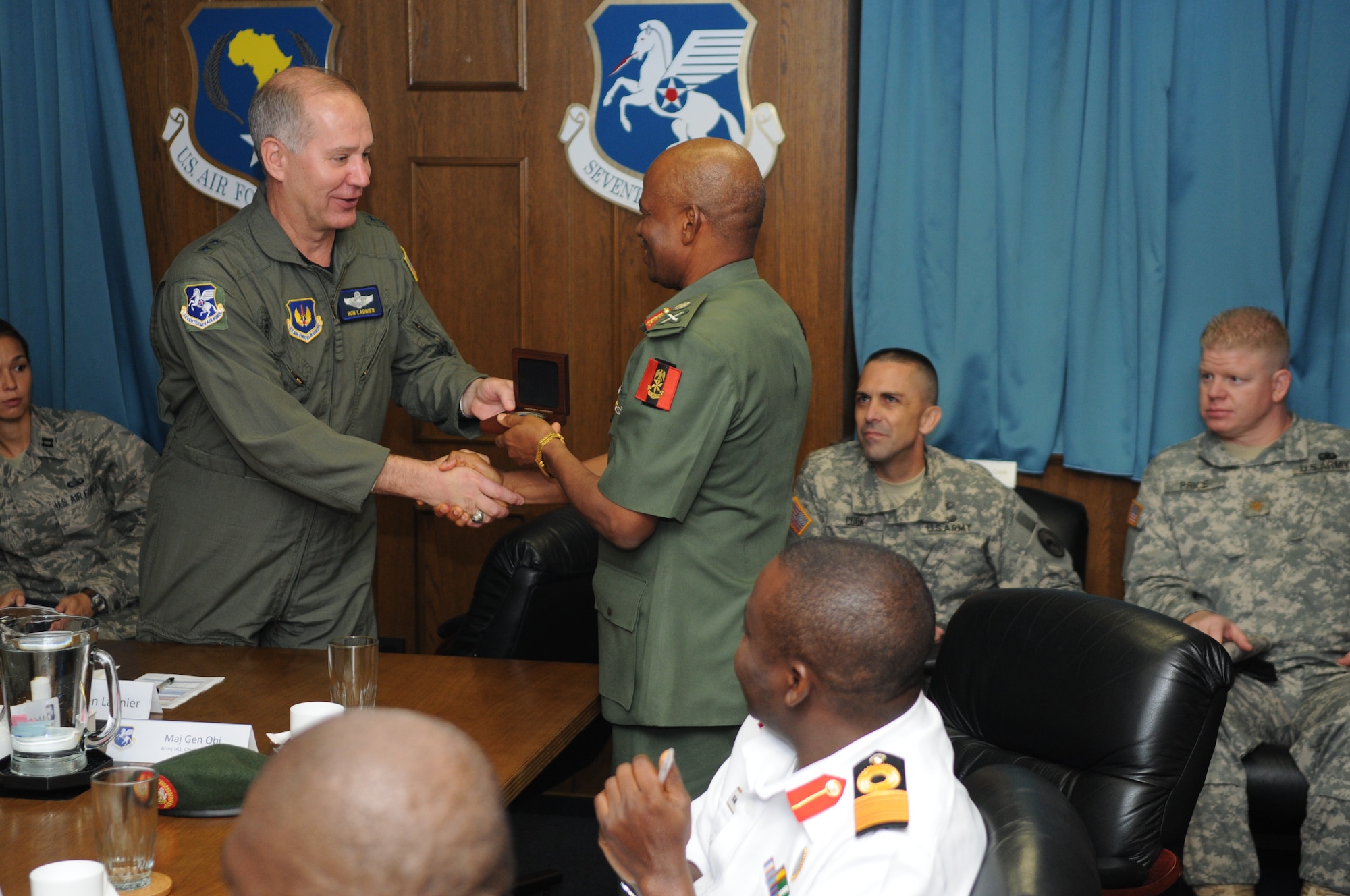 Air Forces Africa (17th Air Force) Commander Maj. Gen. Ron Ladnier presents the gift of a commemorative medallion to Nigerian army Chief of Training and Operations Maj. Gen. Moses Bisong Obi during a visit to Ramstein from a delegation of Nigerian military officials Sept. 11. (USAF photo by Master Sgt. Jim Fisher) 