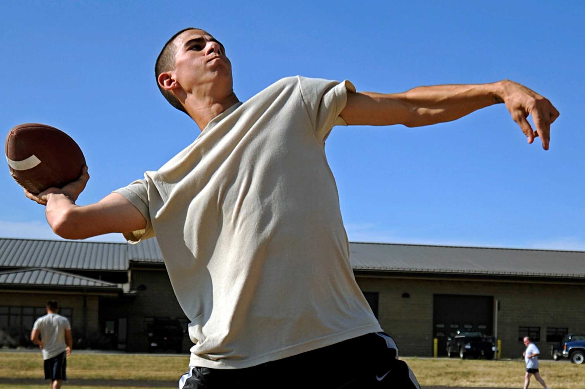 Airman 1st Class Javier Mendoza, 28th Logistics Readiness Squadron vehicle operations technician, throws a football during the throwing power event of a football competition here, Sept. 10. The competition was open to the base populace to test various football skills.  Events such as punting, standing jump and field goal kick were part of the competition. (U.S. Air Force photo/Airman 1st Class Matthew Flynn)
