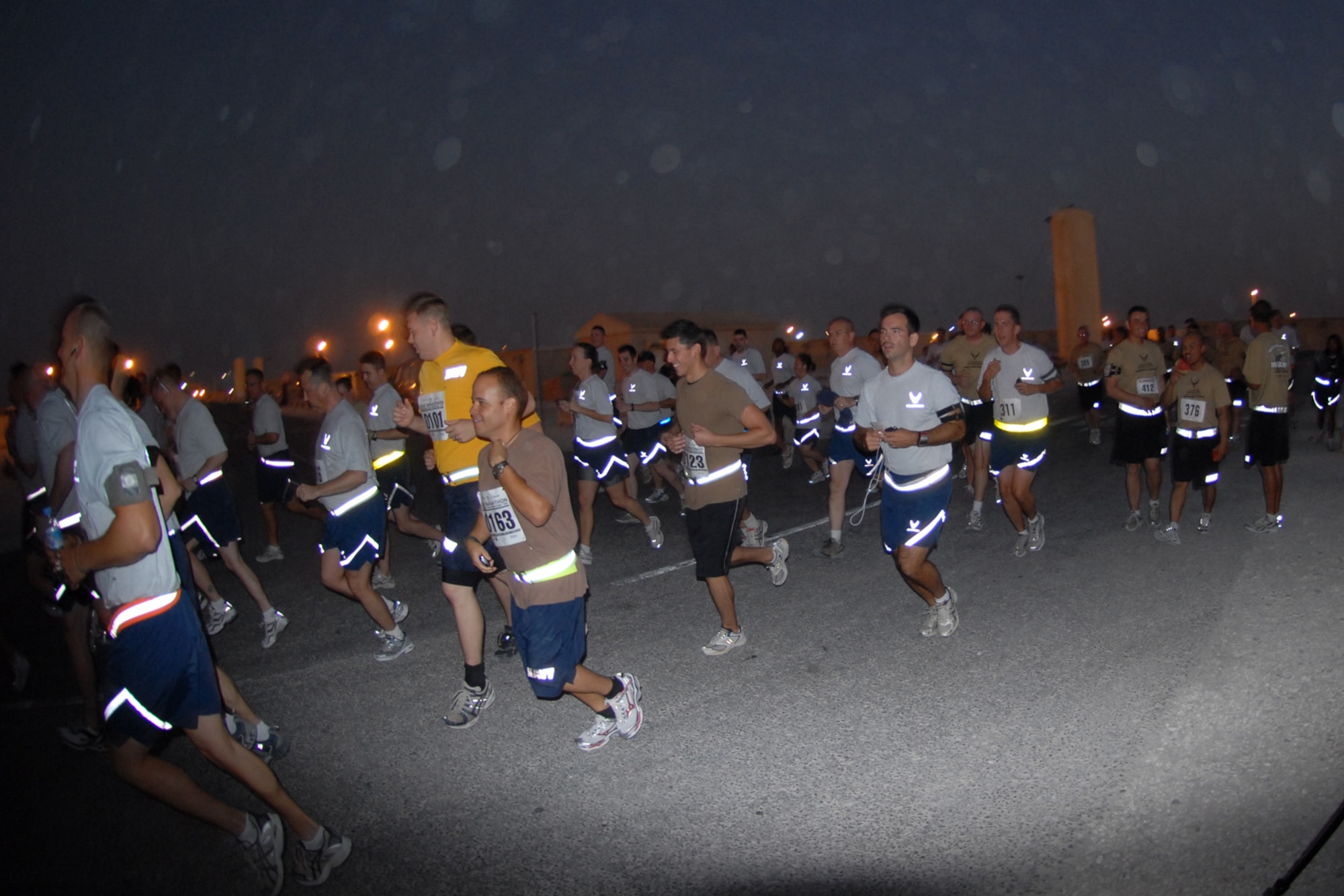 SOUTHWEST ASIA -- Deployed servicemembers begin an early-morning start in the base half-marathon and 10K runs, here, Sept. 11. More than 350 participants gathered for the run just as the sun was starting to rise over the region. (U.S. Air Force Photo/Tech. Sgt. Jason W. Edwards)