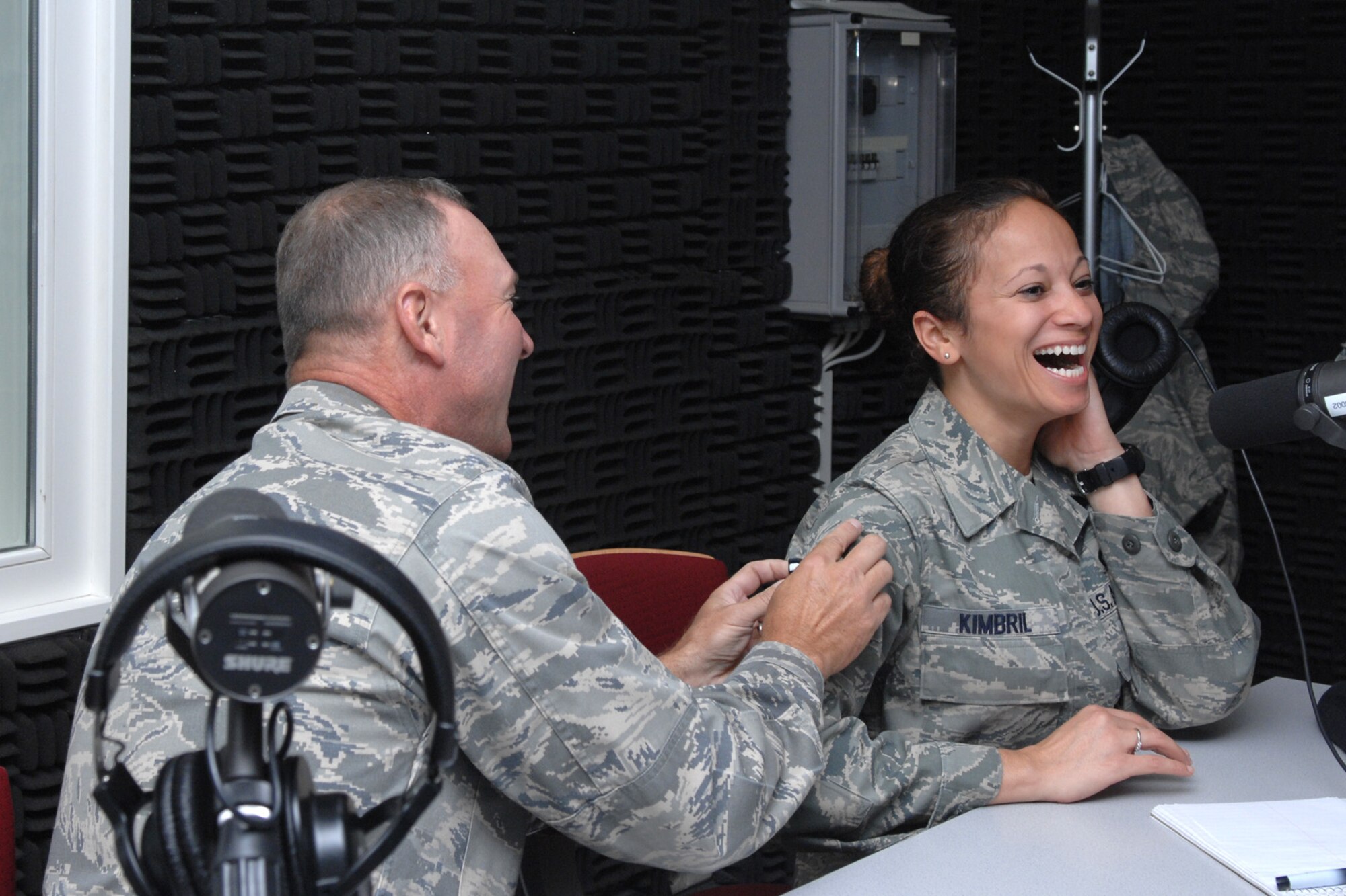 SPANGDAHLEM AIR BASE Germany – 52nd Fighter Wing Commander Tip Wight tacks technical sergeant stripes on to then Staff Sgt. Kimberly Kimbril, 52nd Fighter Wing Advanced Programs Office, during the commander’s radio show Sept. 4.  Sergeant Kimbril was surprise with an on-air Stripes for Excellent Performers promotion. (U.S. Air Force photo/Airman 1st Class Staci Miller)