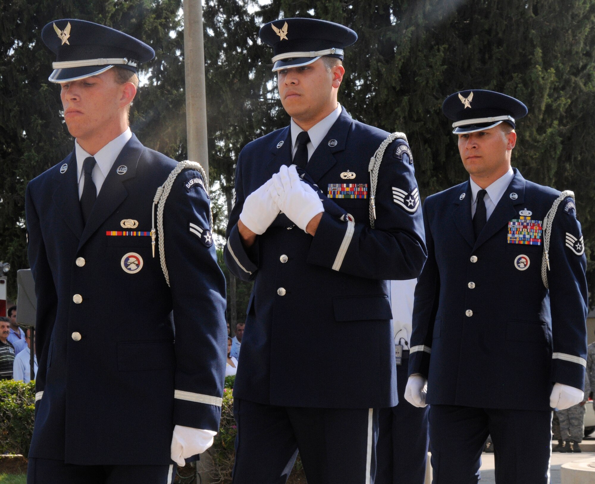 Airmen from Incirlik’s Honor Guard carry out the flag during the 9/11 Remembrance Ceremony Sept. 11, 2009 at Incirlik Air Base, Turkey.  Members from the Airmen Committed to Excellence club helped organize the ceremony for the base populace. Both American and Turkish personnel were present at the flag pole in support of the eighth anniversary of the terror attacks on America. (U.S. Air Force photo/Airman 1st Class Amber Ashcraft)
