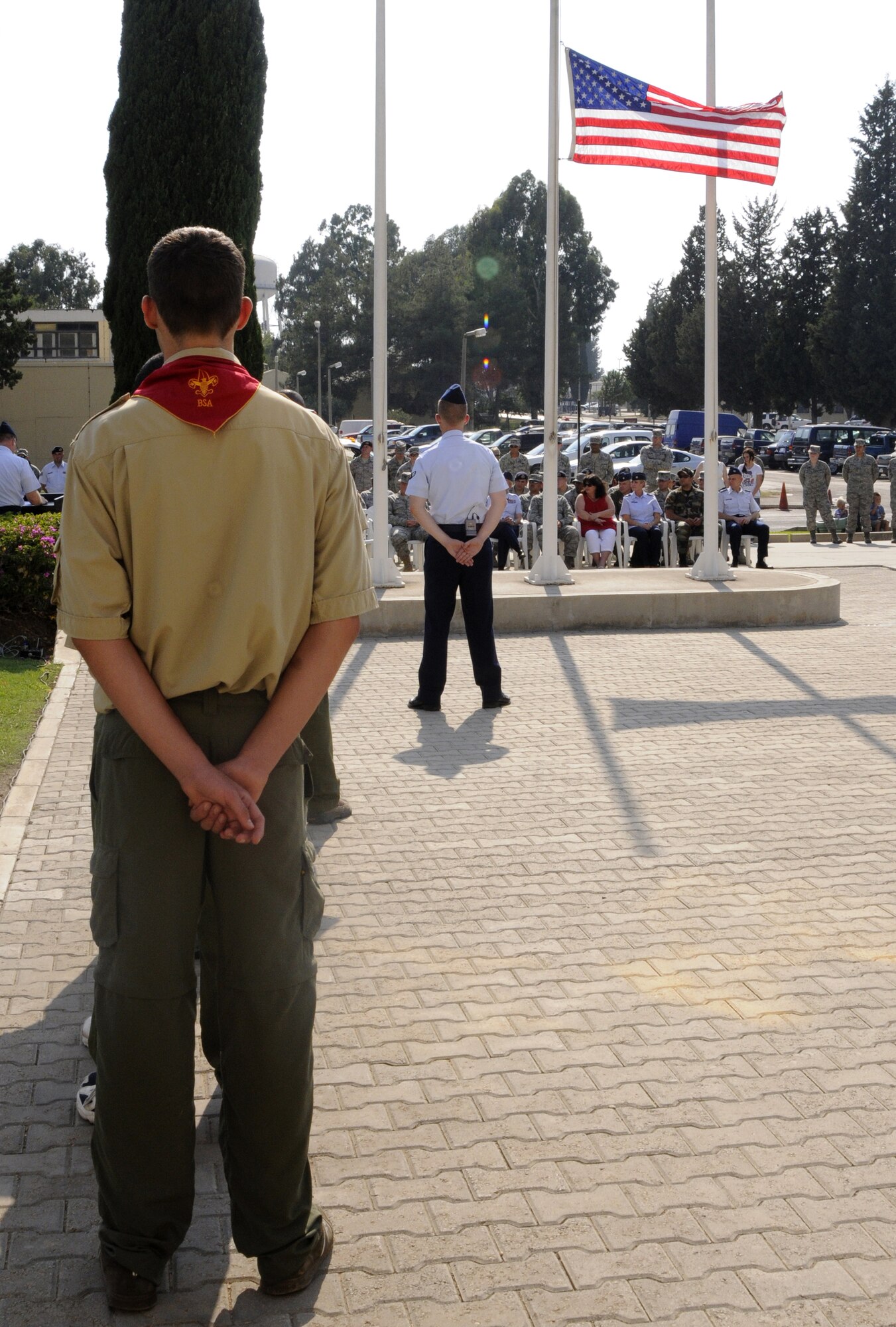 Incirlik Boy Scouts stand at parade rest during the 9/11 Remembrance Ceremony Sept. 11, 2009 at Incirlik Air Base, Turkey. Members from the Airmen Committed to Excellence club helped organize the ceremony for the base populace. Both American and Turkish personnel were present at the flag pole in support of the eighth anniversary of the terror attacks on America. (U.S. Air Force photo/Airman 1st Class Amber Ashcraft)