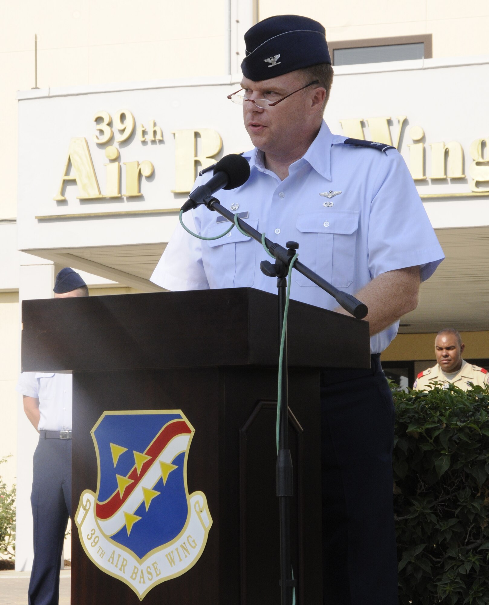 Col. Eric Beene, 39th Air Base Wing commander, speaks words of remembrance to the members of Incirlik during the 9/11 Remembrance Ceremony Sept. 11, 2009 at Incirlik Air Base, Turkey. Members from the Airmen Committed to Excellence club helped organize the ceremony for the base populace. Both American and Turkish personnel were present at the flag pole in support of the eighth anniversary of the terror attacks on America. (U.S. Air Force photo/Airman 1st Class Amber Ashcraft)