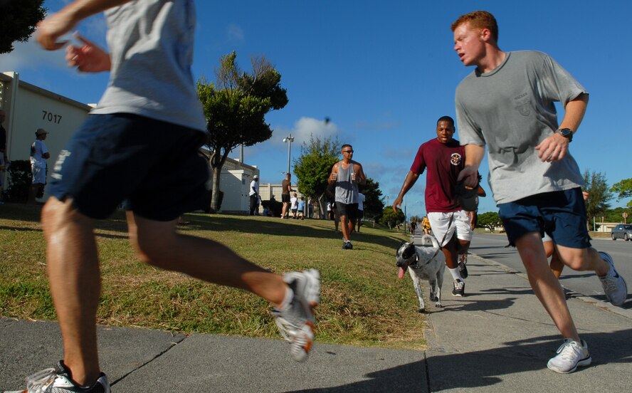 Participants enjoy their morning taking part in Kadena's Special Olympics 5K run fundraiser held at the Risner Fitness Complex Sept. 12. The event had 400 runners and it raised $2,768 with participants ranging from middle grade school level to senior officers.   (U.S. Air Force photo/Tech. Sgt. Reynaldo Ramon) 
