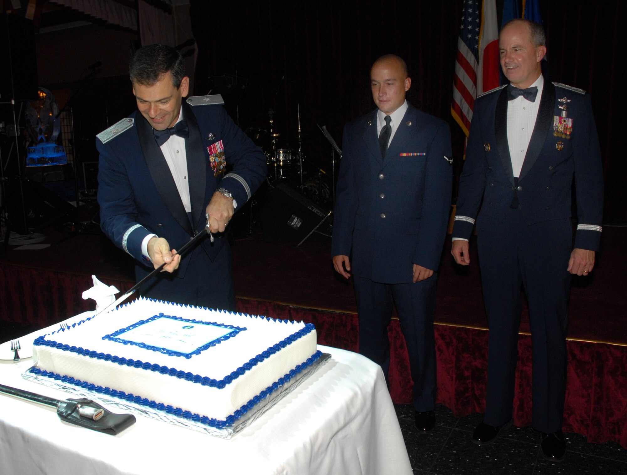 Brigadier General Ken Wilsbach, 18th Wing commander, cuts the cake during the 2009 Air Force Ball at Kadena's Rocker NCO Club Sept. 12. The Air Force Ball was held to celebrate the 62nd birthday of the United States Air Force.
(U.S. Air Force photo/Airman 1st Class Chad Warren)
