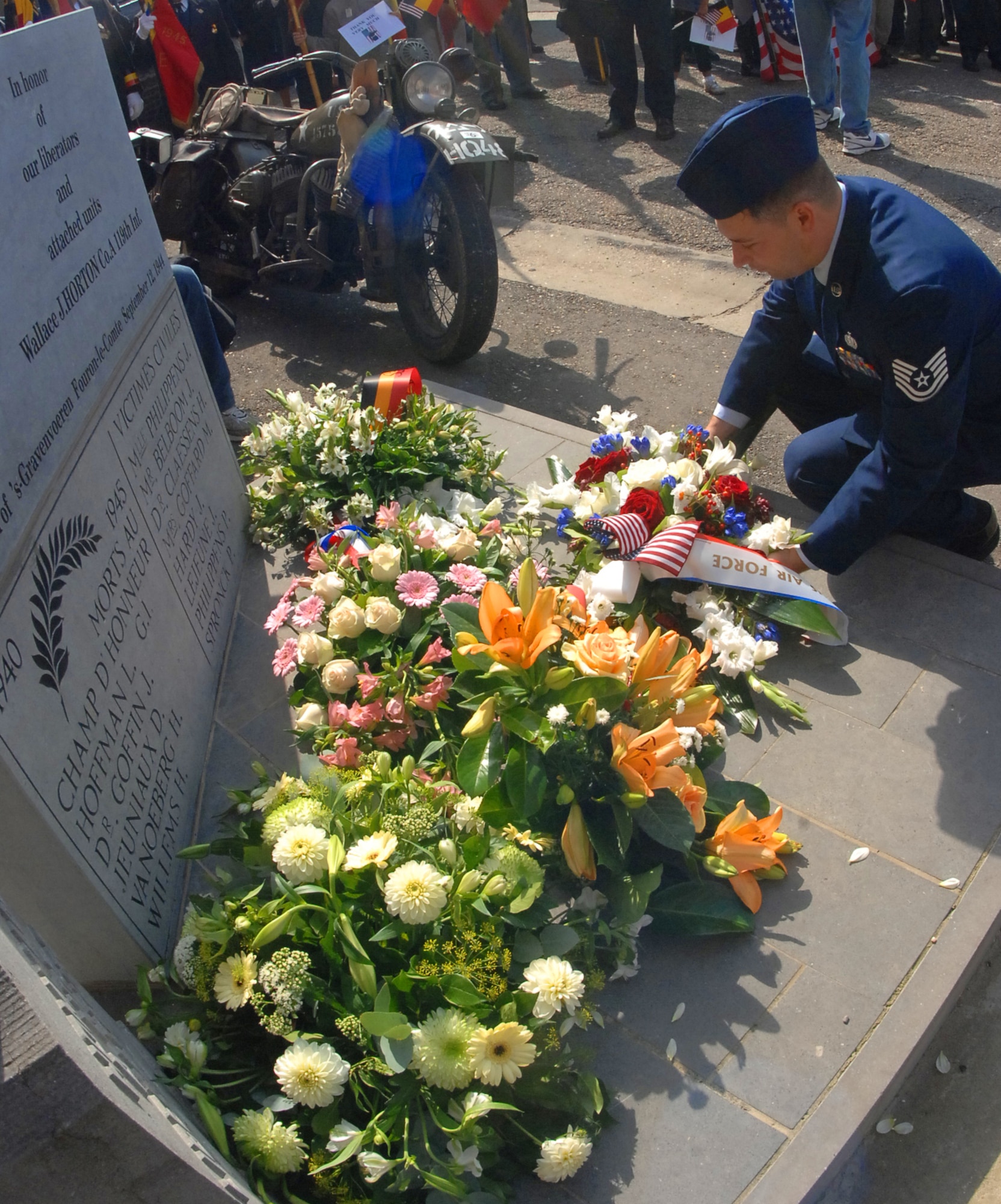 SPANGDAHLEM AIR BASE, Germany -- Tech. Sgt. David Key, a geographically separated unit computer custodian, lays a wreath for the fallen World War II soldiers who died liberating Belgium during a Liberation of Belgium Memorial Event in Fouron le Comte, Belgium, Sept 6.  The 52nd Fighter Wing Honor Guard presented the colors and honored World War II veterans and the fallen Soldiers that liberated Belgium during WWII Sept. 12, 1944. (U.S. Air Force photo/Airman 1st Class Nick Wilson) 
