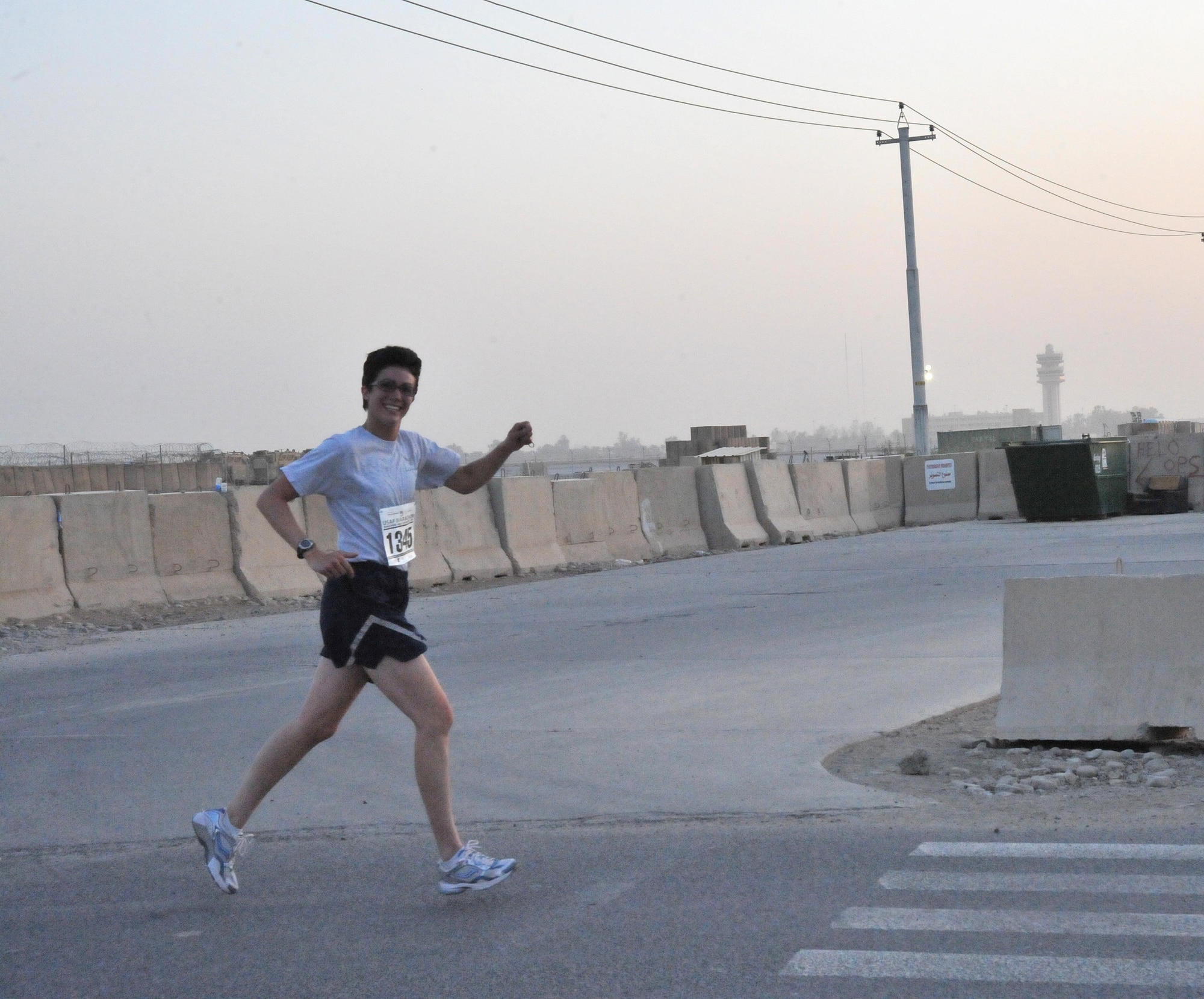 SATHER AIR BASE, Iraq -- Capt. Kelly Neuenfeldt, 447th Expeditionary Security Force Squadron, took second place in Sather's Air Force Marathon 10K running it in 54 minutes and 32 seconds Sept. 5.  (U.S. Air Force photo/Staff Sgt. Misty D. Slater)
