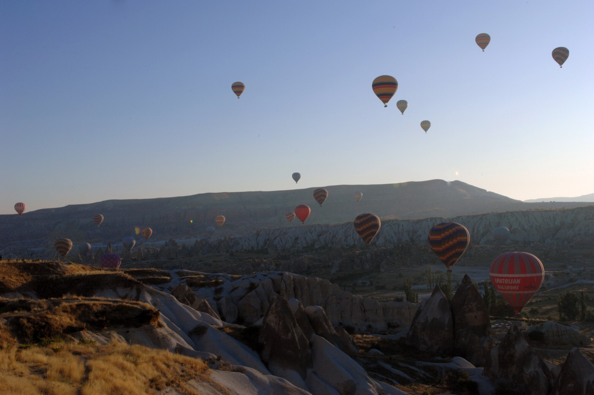 Hot air balloons soar over a valley  of the dramatic rock formations that form the famous moonscape of the region of Cappadocia, Turkey. (U.S. Air Force photo/Staff Sergeant Lauren Padden)
