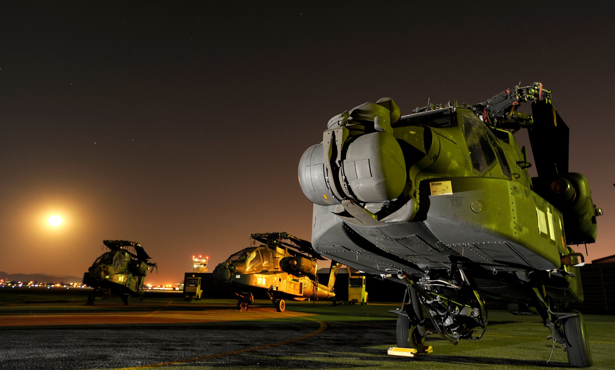 Three AH-64D Apache Longbows sit on the Osan Air Base flightline Sept 9. These helicopters are the first of 24 the Army is swapping for the newer block II model over the next four months.  (U.S. Air Force photo/Staff Sgt. Brian Ferguson)

