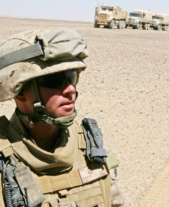 Marine Corps Gunnery Sgt. Steven Baker stands in front of a mine-resistant, ambush-protected vehicle Sept. 8, 2009, in Afghanistan’s Helmand province. Baker served on a convoy as assistant convoy commander. U.S. Marine Corps photo by Cpl. Aaron Rooks