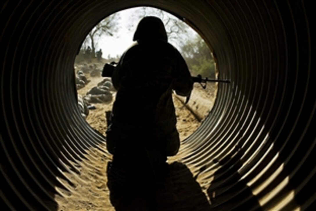 A trainee prepares to enter the last leg of the tactical course at the Basic Expeditionary Airman Training course on Lackland Air Force Base, Texas, Sept. 2, 2009.