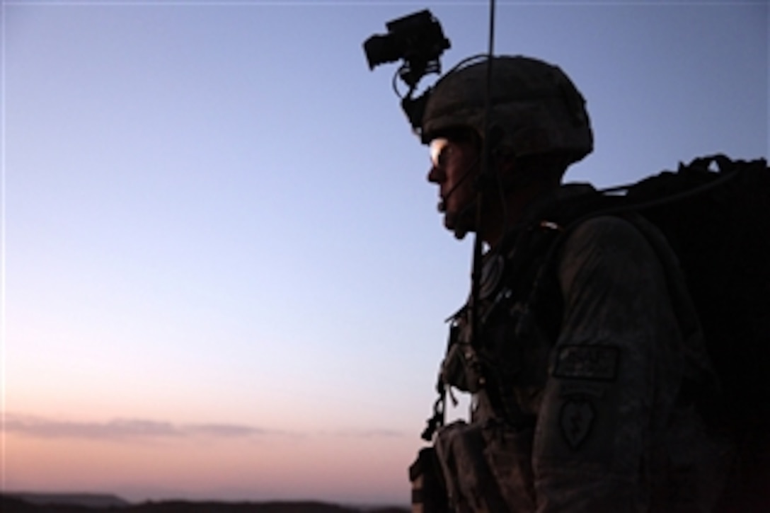 U.S. Army Staff Sgt. Roger Schilling scans the terrain during a night patrol in the mountains near Sar Howza, Paktika province, Afghanistan, on Sept. 4, 2009.  Schilling is deployed with Bulldog Troop, 1st Squadron, 40th Cavalry Regiment (Airborne), 4th Brigade, 25th Infantry Division.  