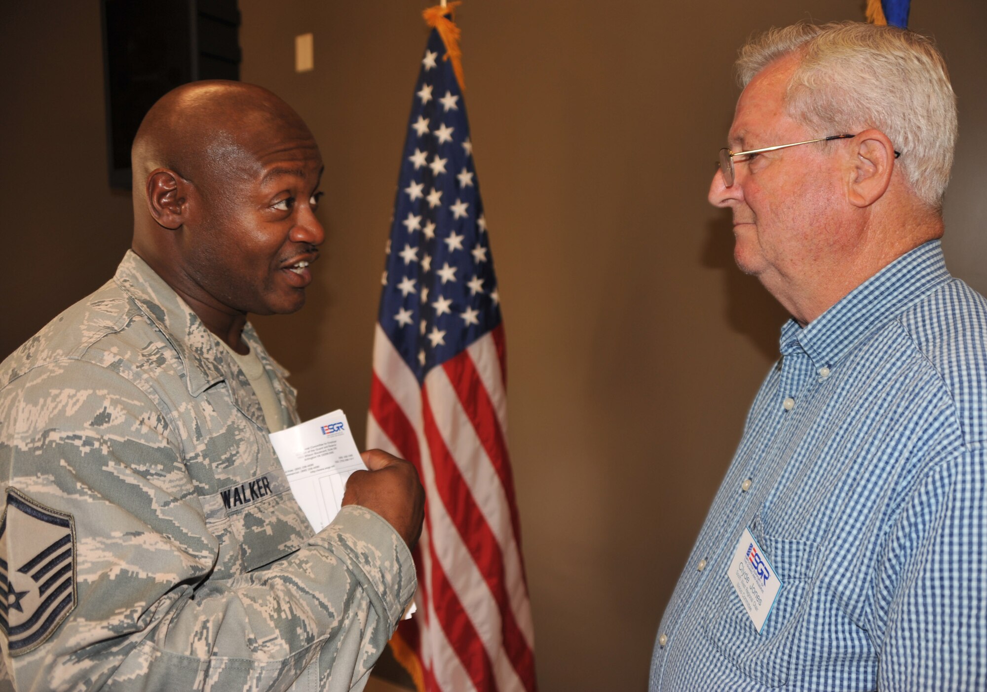 Tech. Sgt. Rico Walker meets Clyde Jones, ombudsman for the Illinois Employer Support of the Guard and Reserve.  Mr. Jones visited the 932nd Airlift Wing before a drill weekend to answer questions for members of the Air Force Reserve.  (U.S. Air Force photo/Maj. Stan Paregien)