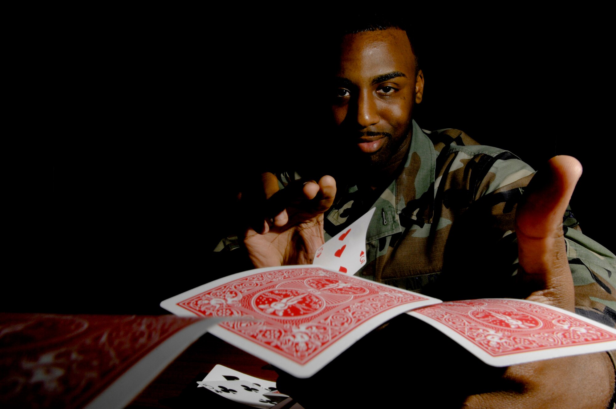 ELMENDORF AIR FORCE BASE, Alaska -- Senior Airman Adam Rideaux, 3rd Medical Group admissions office, displays some of his magic talent Sept. 11. Rideaux grew up intrigued by magic and has been involved with it since age 7. He has performed at various base functions and private parties. (U.S. Air Force photo/Airman 1st Class Christopher Gross)