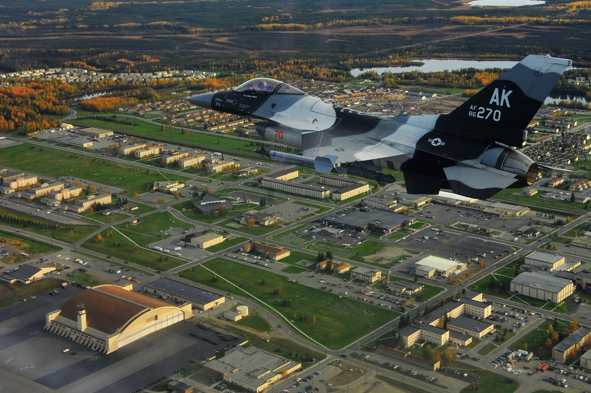 An F-16 Aggressor flies over Eielson Air Force, Base, Alaska, Sept. 14, 2009. The F-16 is assigned to the 18th Aggressor Squadron, which is responsible for training and preparing joint and allied aircrews for combat missions. (U.S. Air Force photo/Staff Sgt. Christopher Boitz)