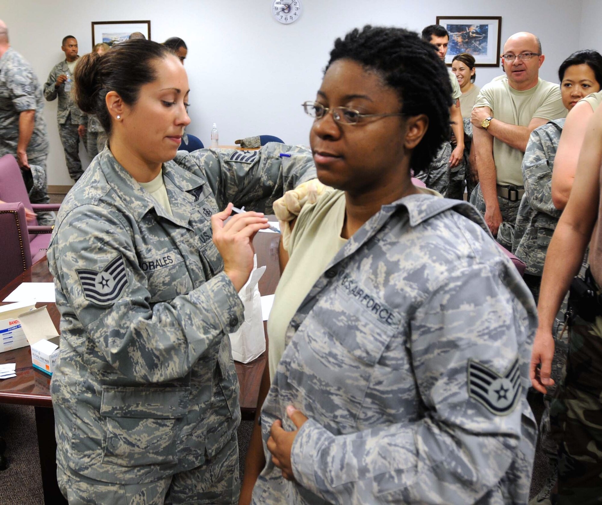 Tech. Sgt. Melissa Morales, 944th Medical Squadron, gives a flu shot Sept. 13. The 944th Medical Squadron will continue to administer the shots in preparation for flu season. (U.S. Air Force photo/Staff Sgt. Louis Vega)