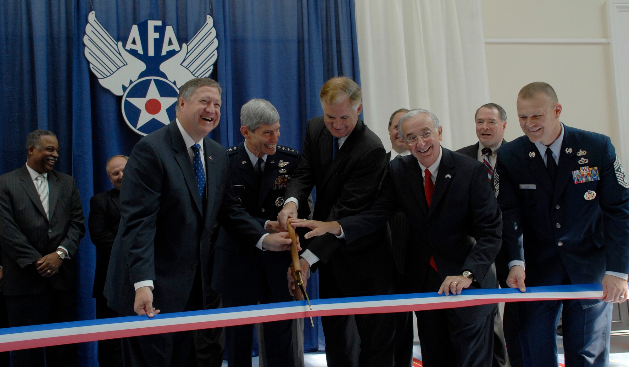 Secretary of the Air Force Michael Donley, Air Force Chief of Staff Gen. Norton Schwartz and Chief Master Sergeant of the Air Force James A. Roy welcome conference attendees during a ribbon-cutting ceremony at the 2009 Air Force Association Air & Space Conference and Technology Exposition Sept. 14, 2009, in Washington D.C. (U.S. Air Force photo/Master Sgt. Stan Parker)
