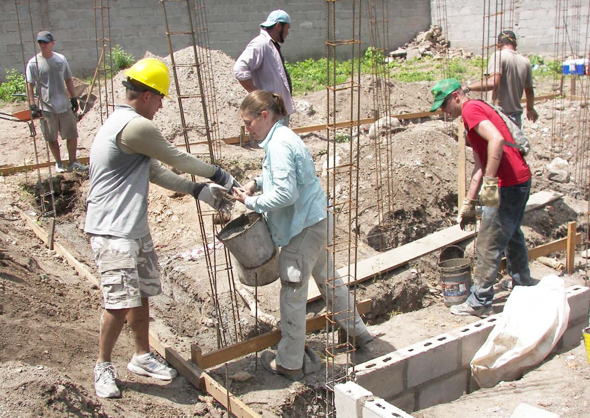 SOTO CANO AIR BASE, Honduras — Volunteers from Joint Task Force-Bravo help pour cement and lay the foundation for a family's house during a Habitat for Humanity Honduras build Sept. 12 in La Paz. JTF-Bravo members have been working with Habitat since March 28, and since then they have helped Habitat with a total of 11 houses in La Paz and Comayagua (Courtesy Photo).