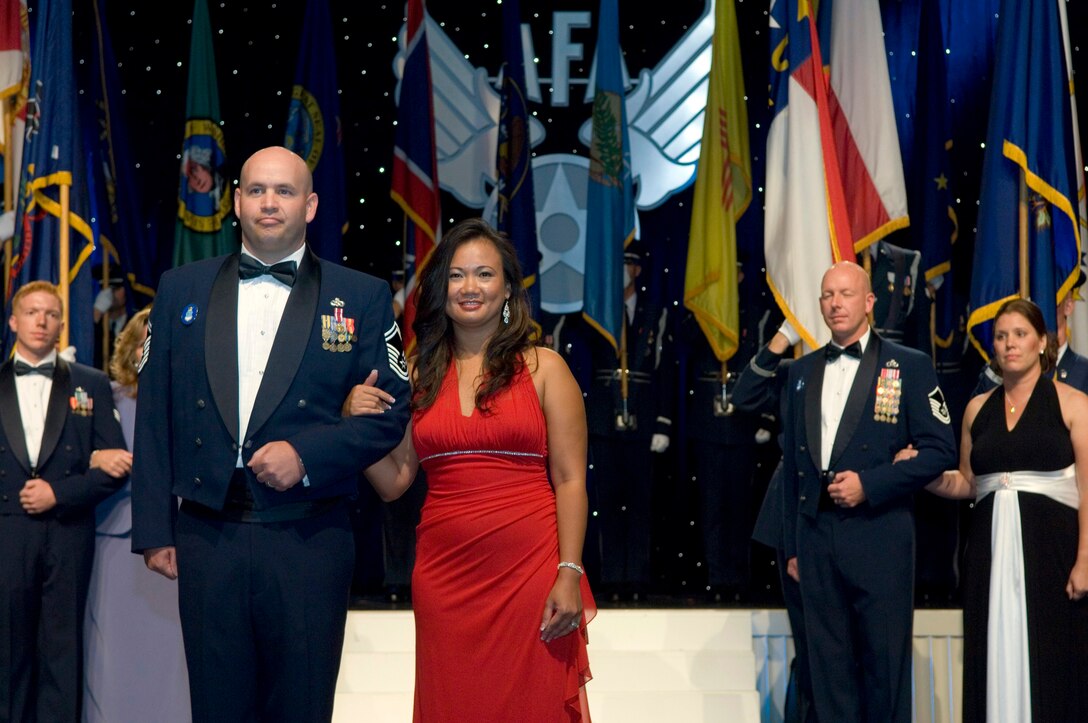 Senior Master Sgt. Jeffery Steagall and his wife, Eileen are introduced during the 2009 12 Outstanding Airmen of the Year dinner Sept. 14, 2009, at the Gaylord National Hotel and Convention Center, National Harbor, Md.  Sergeant Steagall is a communications and information systems inspections manager assigned to Peterson Air Force Base, Colo. Sergeant Steagall is one of the 12 Outstanding Airmen of the Year. (U.S. Air Force photo/Staff Sgt. Desiree N. Palacios)