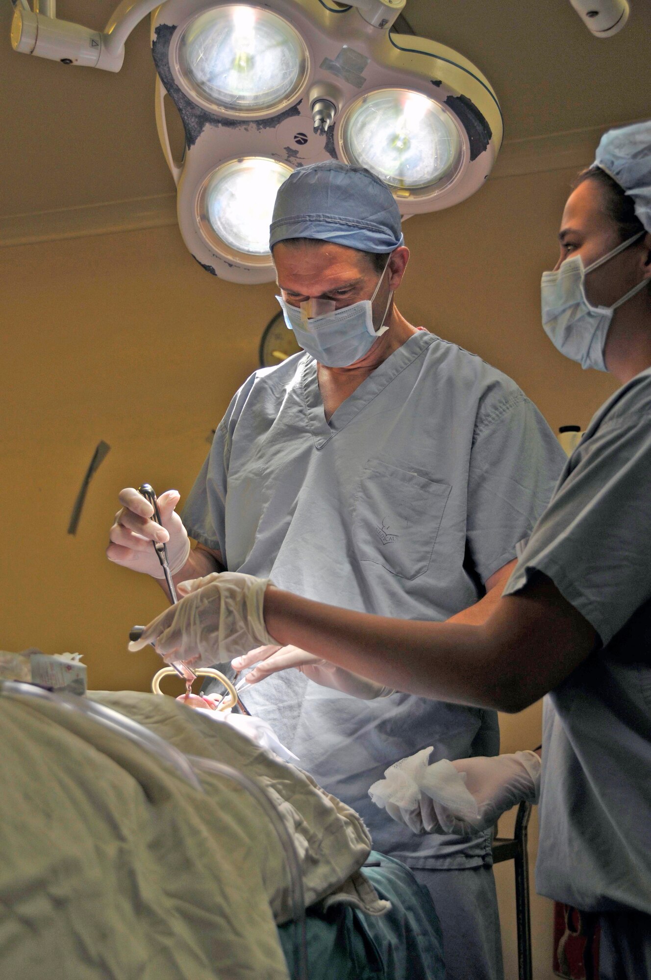 Lt. Col. Mark Packer prepares a patient for surgery Aug. 6, 2009, at the Georgetown Public Hospital in Georgetown, Guyana. Colonel Packer is one of the sub-specialists for medical conditions of the ear, nose and throat that deployed here to provide free medical care to the Guyanese citizens. Colonel Packer is a neuro-otologist from the 59th Medical Wing at Wilford Hall at Lackland Air Force Base, Texas. (U.S. Air Force photo/Airman 1st Class Perry Aston)