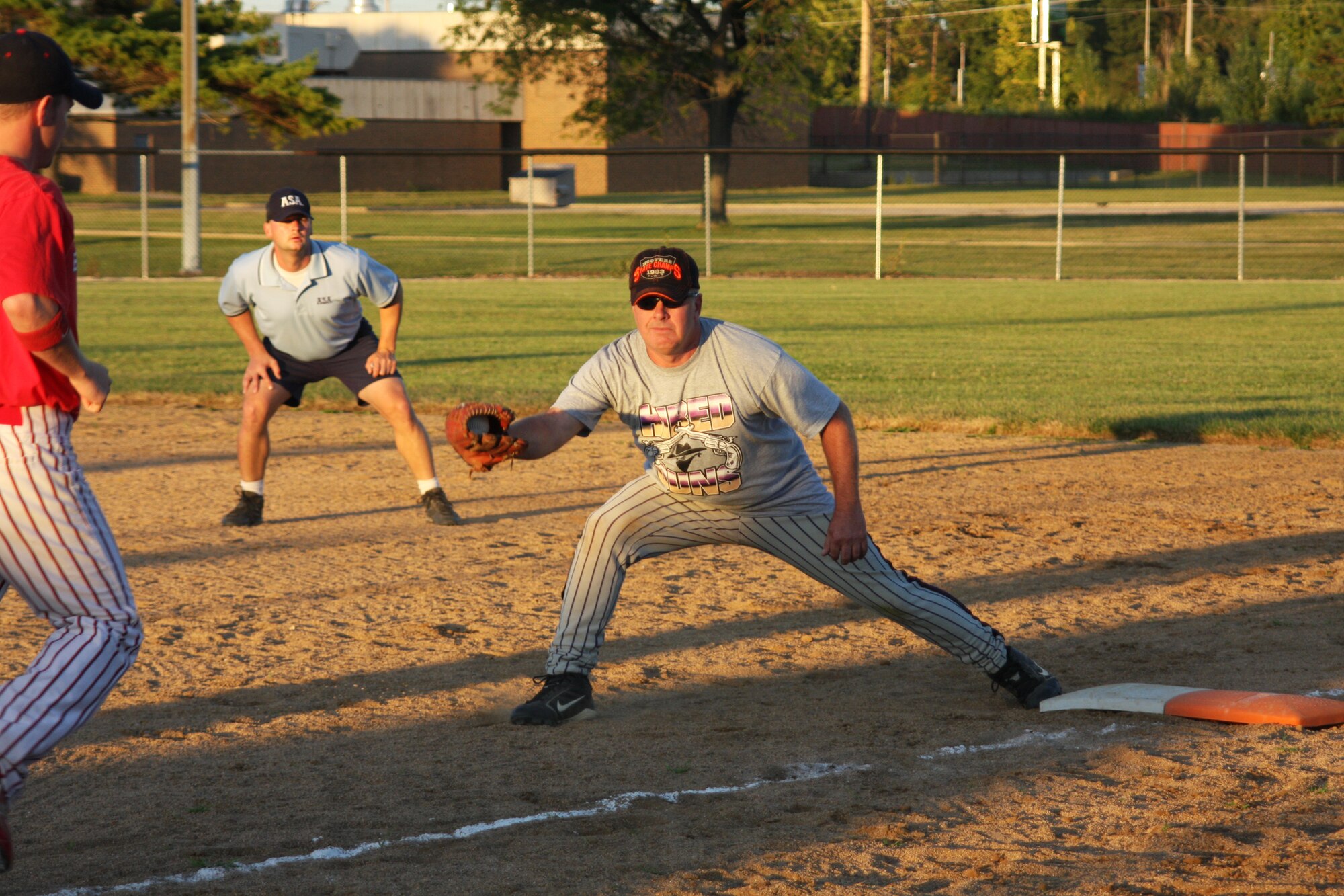 WRIGHT-PATTERSON AFB, Ohio - Tech. Sgt. Mike Ferguson, 445th Maintenance Squadron, catches a ball at first base during the second annual Wright-Patterson Air Force Base Active Duty vs. Reserve Softball Challenge Sep. 12, 2009.  (Air Force photo/Tech. Sgt. Jeremy Caskey) 