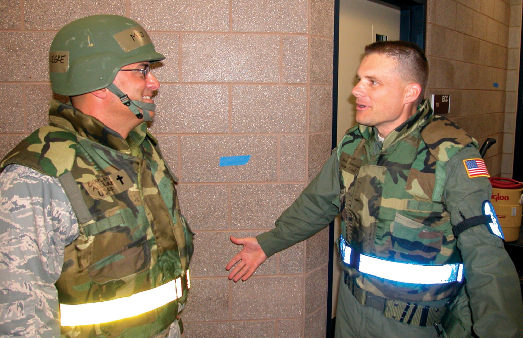 ALPENA, Mich. -- AIr Force Reserve Chaplain (Maj.) Pierre Allegre (left) shares a laugh with Col. Michael Hornitschek during a mobility exercise at Alpena Combat Readiness Training Center here Sept. 14. Chaplain Allegre is part of the 446th Airlift Wing chaplain team and Colonel Hornitschek is the 62nd Airlift Wing vice commander. Airmen from the 446th and 62nd Airlift Wings, McChord Air Force Base, Wash., along with the 319th Air Refueling Wing, Grand Forks, N.D., are participating in an operational readiness exercise Sept. 12-18 as they prepare for an Air Mobility Commad Operational Readiness Inspection later this year. (U.S. Air Force photo/Staff Sgt. Grant Saylor) 