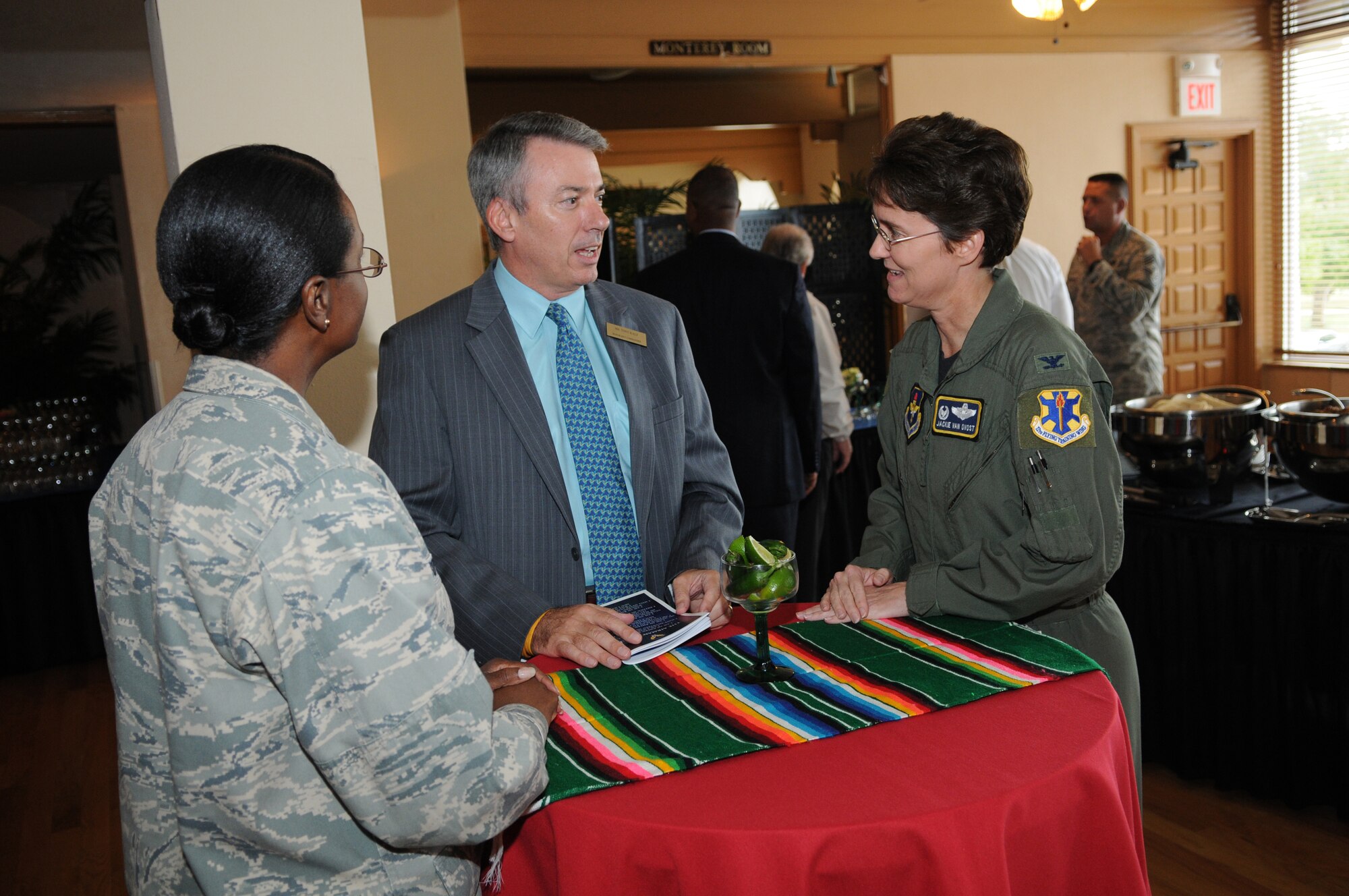 Col. Jacqueline Van Ovost (right), 12th Flying Training Wing commander,and Col. Soledad Lindo-Moon (left), 12th Medical Group commander,  speak with one of the newest Randolph Honorary Commanders,  Tony Ralf during the Honorary Commander's reception Sept. 10. (U.S. Air Force photo/Melissa Peterson)
               