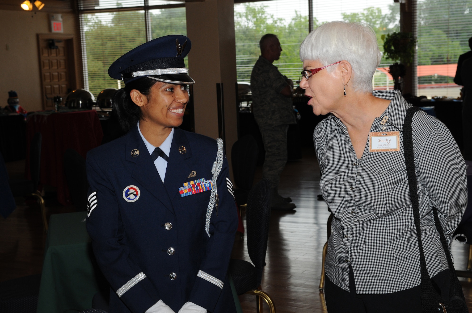 SSgt Cristina Gutierrez of the Randolph Air Force Base Honor Guard speaks with Ms. Becky Painter; a new Randolph Honorary Commander from the City of Live Oak. The Honorary Commanders Program enhances the positive relationship between Randolph Air Force Base and the surrounding communities. The reception was held 10 Sept, at the Randolph Air Force Base Parr Club. (U.S. Air Force photo/Melissa Peterson)   