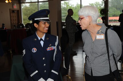 SSgt Cristina Gutierrez of the Randolph Air Force Base Honor Guard speaks with Ms. Becky Painter; a new Randolph Honorary Commander from the City of Live Oak. The Honorary Commanders Program enhances the positive relationship between Randolph Air Force Base and the surrounding communities. The reception was held 10 Sept, at the Randolph Air Force Base Parr Club. (U.S. Air Force photo/Melissa Peterson)   