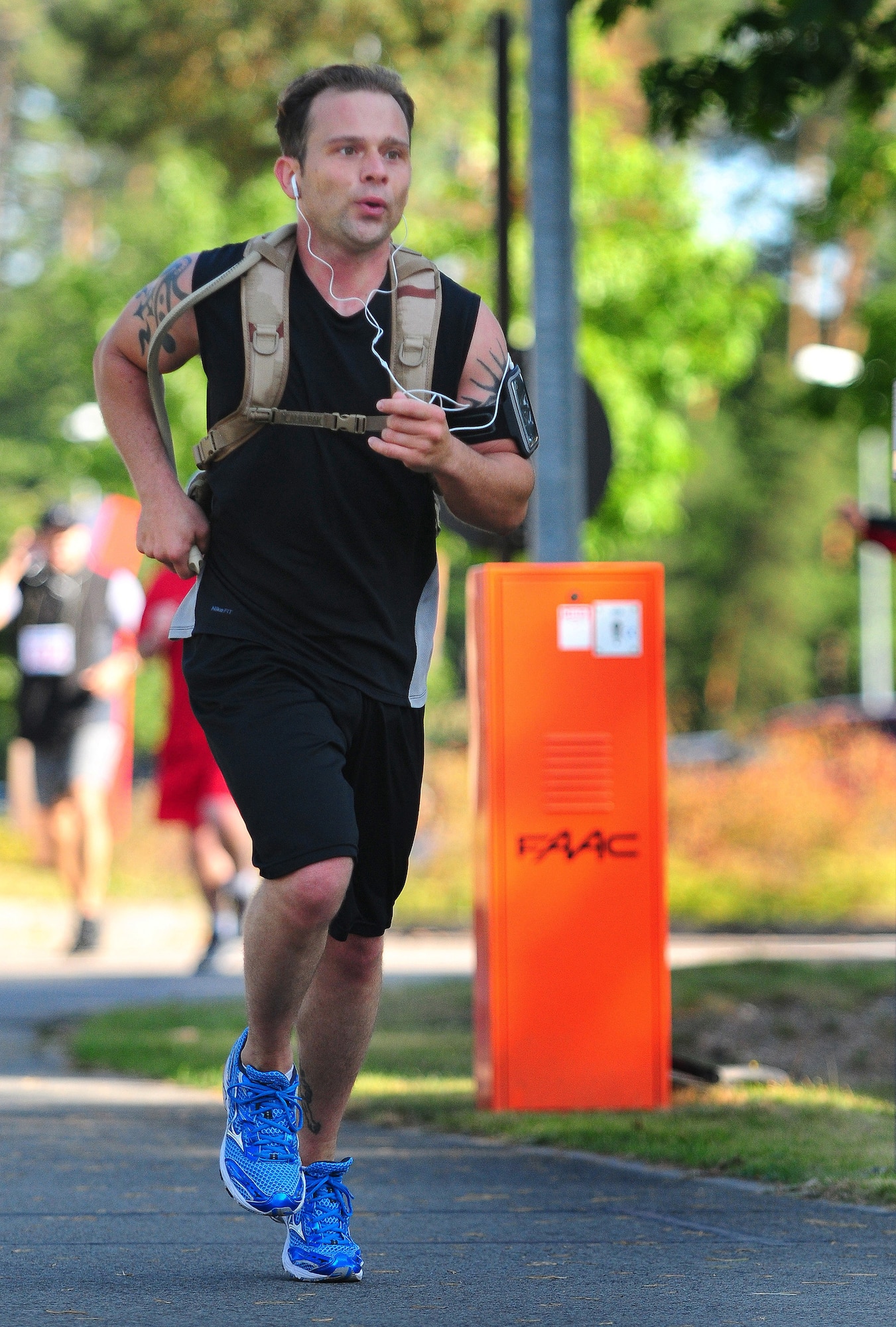 Michael Voss, 86th Airlift Wing Public Affairs journalist, pushes out the last few yards to the finish line during the first ever Kaiserslautern Military Community Half Marathon, Ramstein Air Base, Germany, Sept. 12, 2009.  (U.S. Air Force photo by Staff Sgt. Jocelyn Rich)
