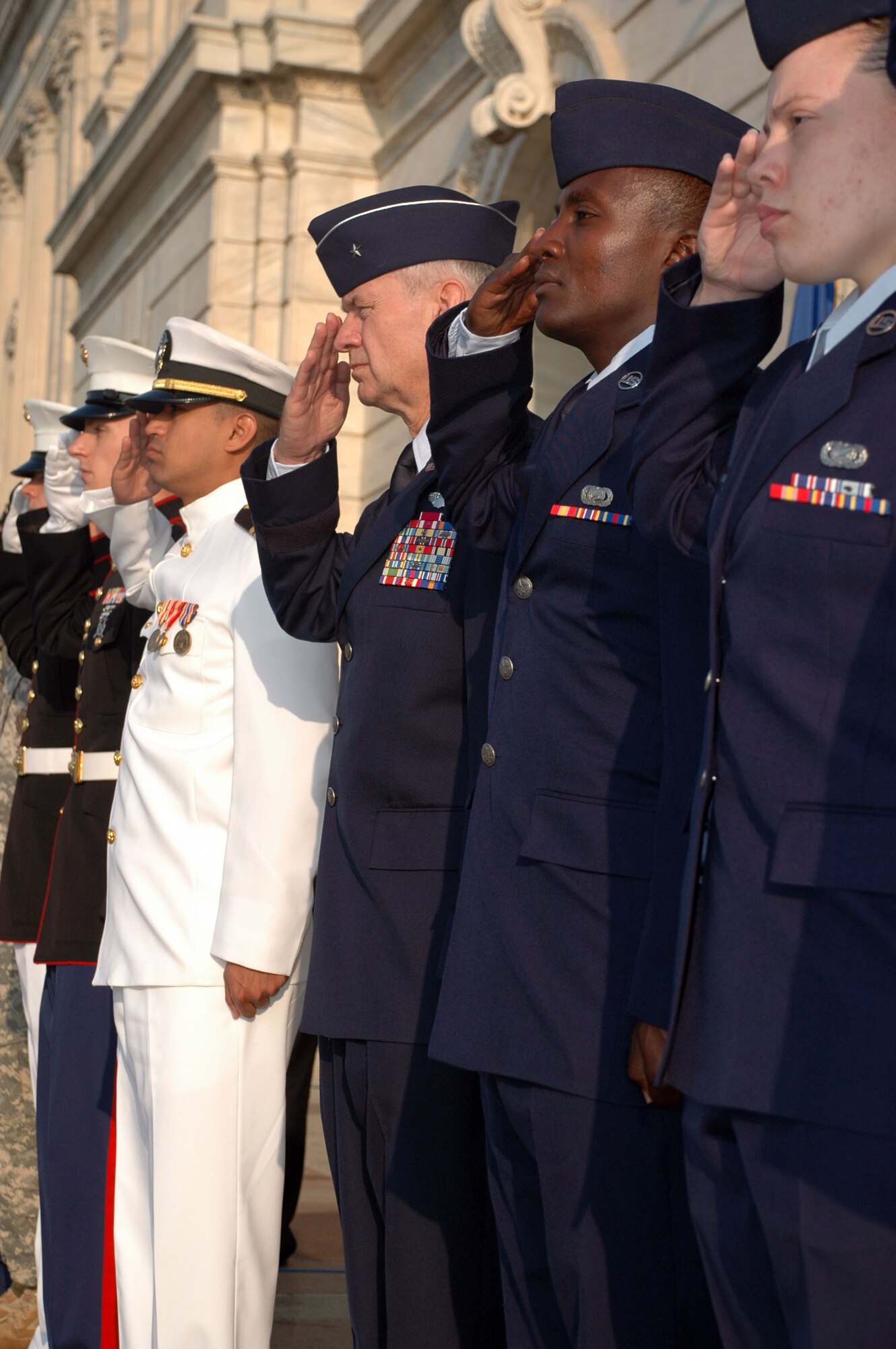 From Left to Right, Brig. Gen. Mark Johnson, Chief of Staff Air, Minn. Air National Guard, Senior Airman Sammy Muriuki, 934th Airlift Wing Communications Flight, and Senior Airman Amaris Carter, 934th CF salute at the Patriot Day 0-11 ceremony at the Minnesota state capitol. (Air Force Photo/Staff Sgt. Josh Moshier) 