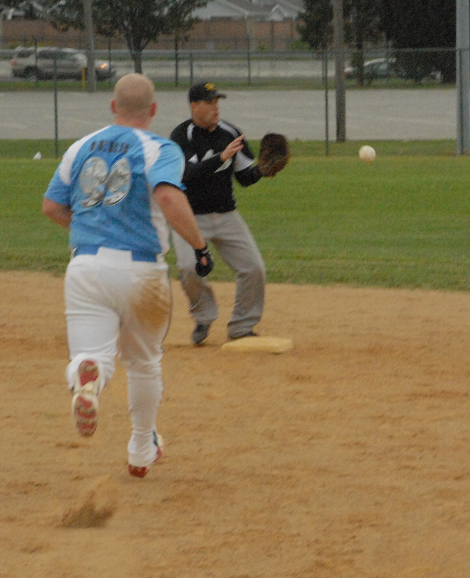 Ben Derry gets caught out at second base by 436th Security Forces Squadron shortstop Rick Barker.  (U.S. Air Force photo/Staff Sgt. Chad Padgett)