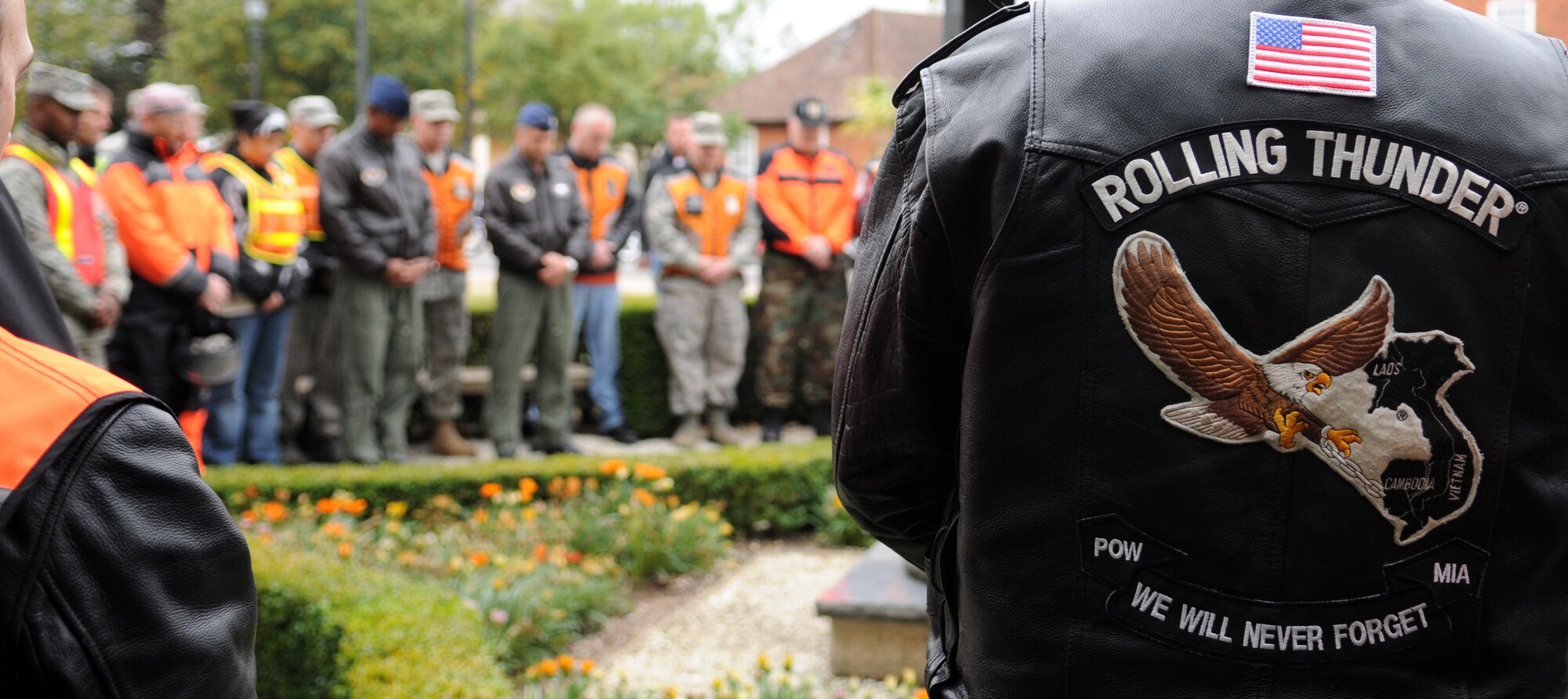 RAF MILDENHALL, England – A jacket reads “Rolling Thunder, we will never forget” as a group of motorcyclist have a moment of silence at the Prisoner of War/Missing in Action memorial Sept 15. The ceremony was one of several events to remember and honor those men and women who were POW/MIA. (U.S. Air Force photo/ Staff Sgt. Jerry Fleshman)