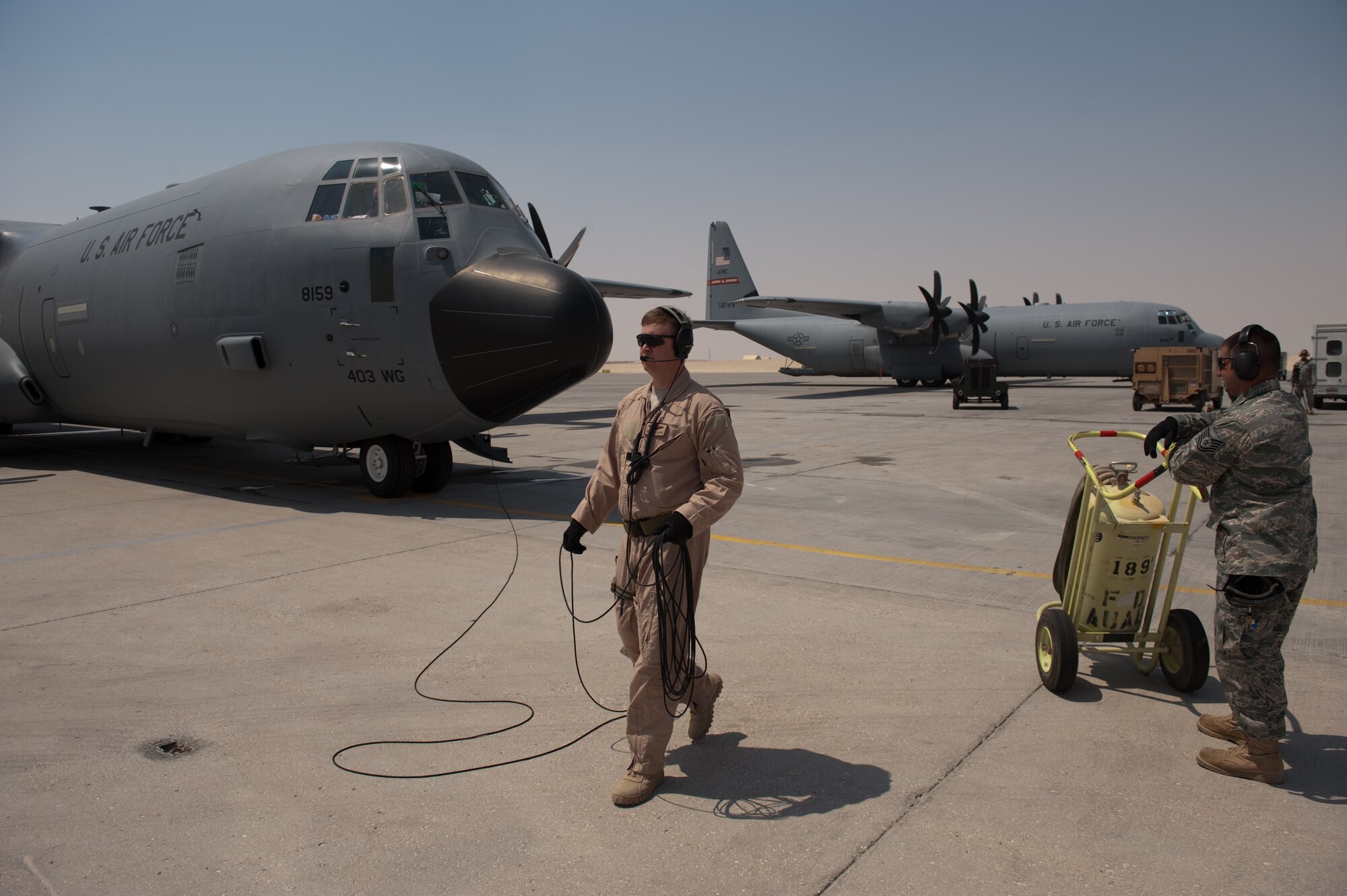 Master Sgt. Dave Cooper, 746th Expeditionary Airlift Squadron loadmaster, prepares a C-130J for take-off, Sept. 14. The 746 EAS flies a variety of missions providing intra-theater combat airlift support throughout Southwest Asia in support of Operations Iraqi and Enduring Freedom. Sergeant Cooper is deployed from Keesler Air Force Base, Miss. (U.S. Air Force photo/Staff Sgt. Robert Barney) 