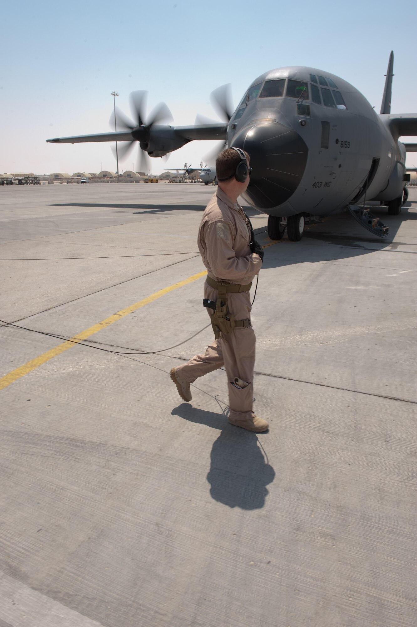 U.S. Air Force Master Sgt. Dave Cooper, 746th Expeditionary Airlift Squadron loadmaster, prepares a C-130J for take-off on a sortie over Southwest Asia, Sept. 14. The 746 EAS flies a variety of missions providing intra-theater combat airlift support throughout Southwest Asia in support of Operations Iraqi and Enduring Freedom. Sergeant Cooper is deployed from Keesler Air Force Base, Miss. (U.S. Air Force photo/Staff Sgt. Robert Barney/RELEASED) 