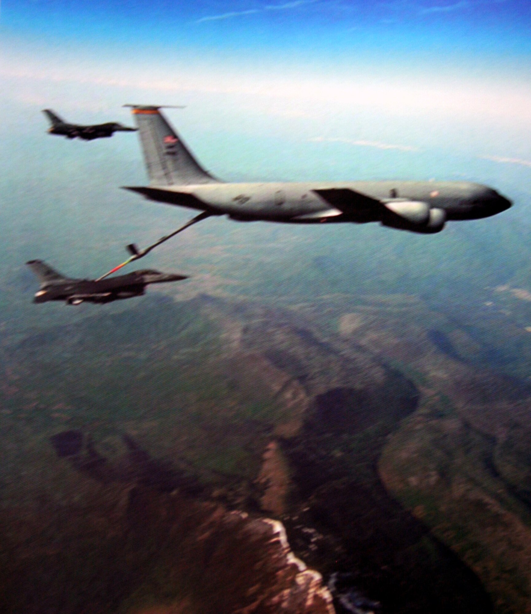 A KC-135R Stratotanker refuels two F-16 Fighting Falcons over northern Bosnia on a combat air patrol mission during Operation Allied Force in 1999. On occasion during the conflict, some tankers were in harm's way and had to change course due to the proximity of enemy aircraft. (U.S. Air Force History Photo)