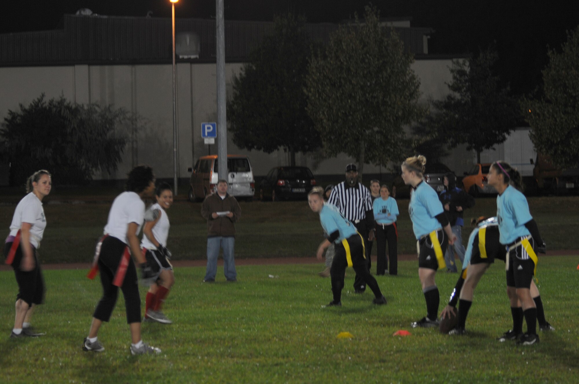 U.S. Air Force Airmen from the 86th Medical Group powder puff flag football team get ready for the play during a game Sept. 14, 2009, Vogelweh Military Complex, Germany. The 86th MDG beat the 86th Vehicle Readiness Squadron 25-7 in their fourth game of the season. (U.S. Air Force photo by Airman 1st Class Alexandria Mosness)