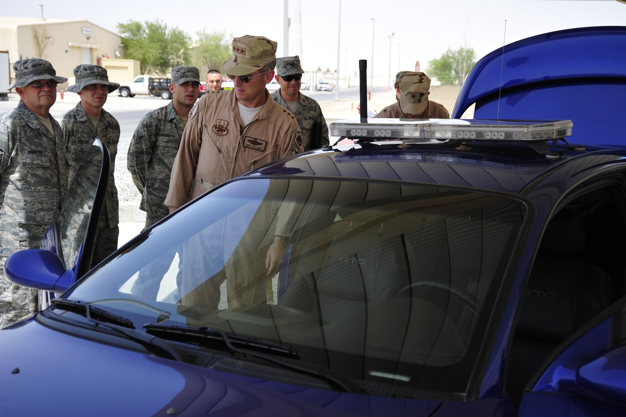 SOUTHWEST ASIA -Lt. Gen. Mike Hostage, Air Force Central Command commander, receives a briefing on the communication systems inside the U-2 aircraft chase car Sept. 13, 2009. General Hostage toured the 380th Expeditionary Communications Squadron facilities during his recent visit. (U.S. Air Force photo/Tech. Sgt. Charles Larkin Sr)