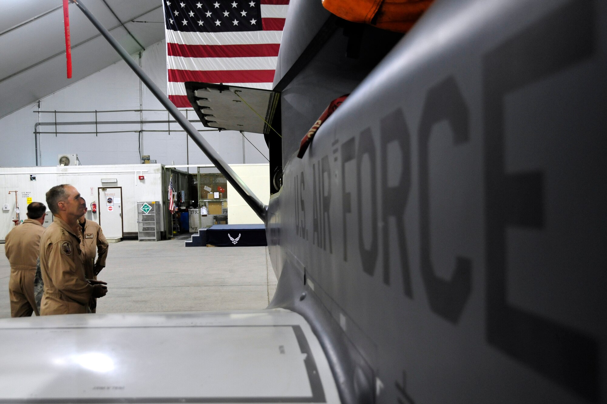 SOUTHWEST ASIA -Lt. Gen. Mike Hostage, Air Force Central Command commander, views the inner workings of a RQ-4 Global Hawk Sept. 13, 2009. General Hostage toured the aircraft, facilities and was briefed by Airmen of the 380th Air Expeditionary Wing during his stay. (U.S. Air Force photo/Tech. Sgt. Charles Larkin Sr)