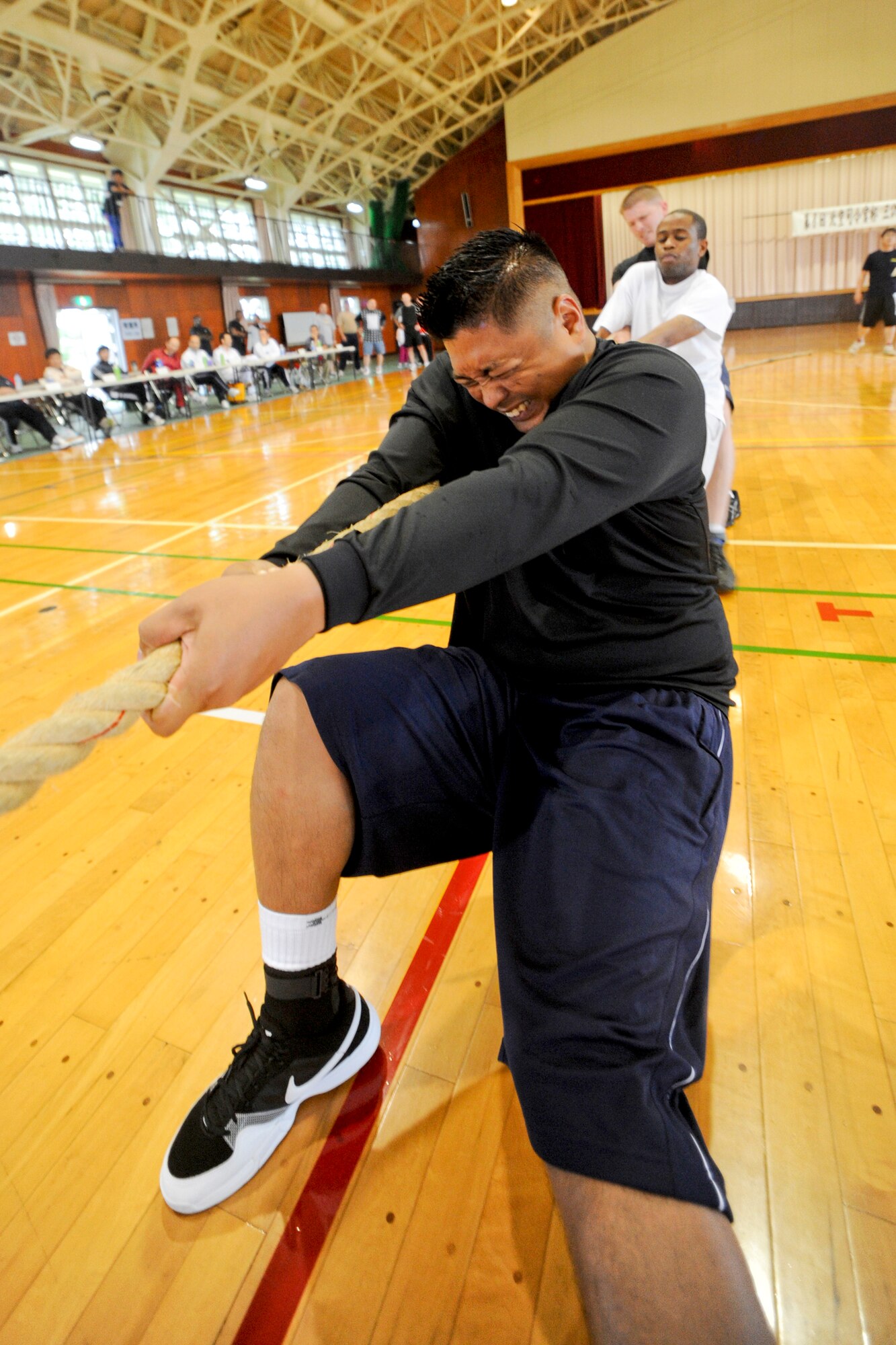 MISAWA AIR BASE, Japan -- The 35th Communications Squadron’s Comm Rockers compete during the Misawa Air Base Tug-of-war Tournament Sept. 12. The event allowed American and Japanese personnel to bond and strengthen ties. (U.S. Air Force photo/Senior Airman Jamal D. Sutter)