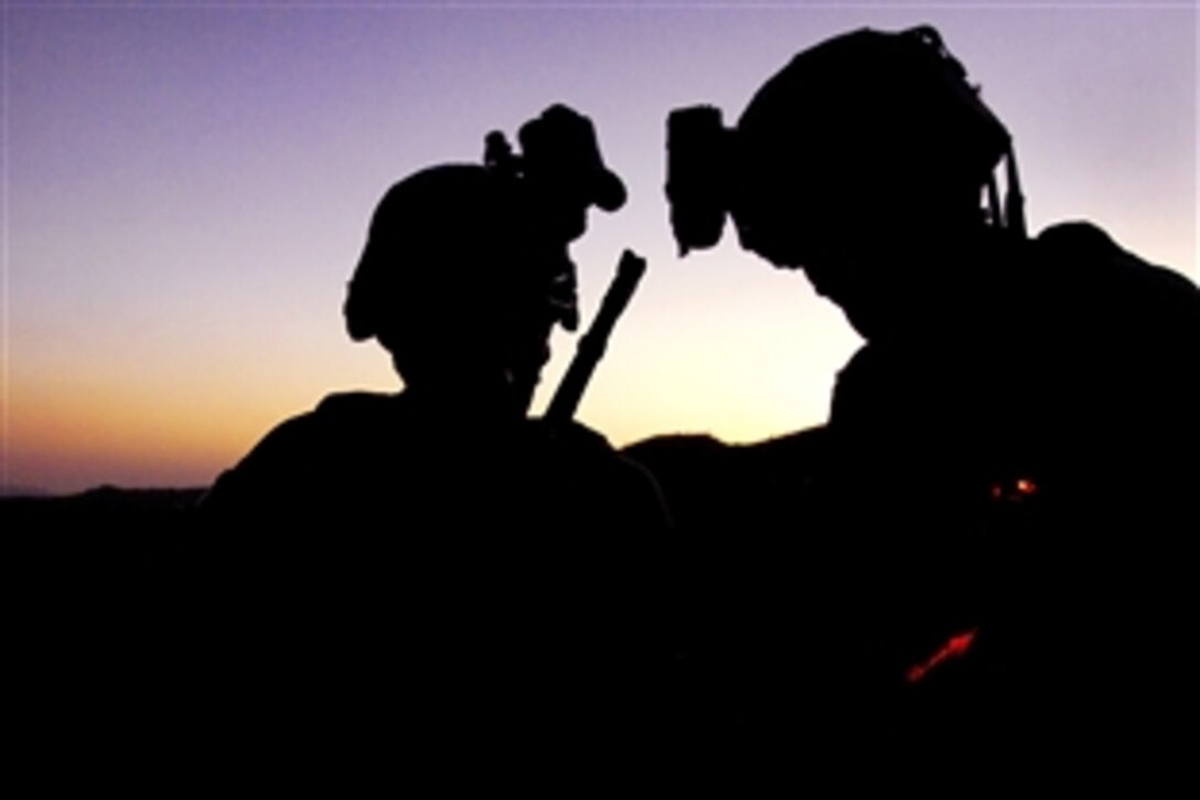 U.S. Army soldiers plan to move to the next mission objective during Operation Champion Spear outside the village of Marsac in Paktia province, Afghanistan, Sept. 3, 2009. The soldiers are assigned to the 25th Infantry Division's 1st Battalion, 501st Infantry Regiment, 4th Brigade Combat Team.