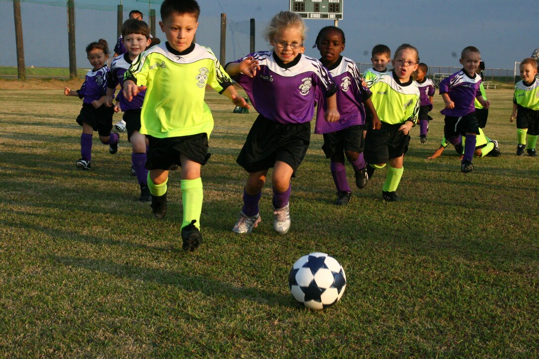 Players from the 3- to 4-year-old age division make a play toward the ball during the first week of the 2009 Youth Soccer season. The season kicked off with an opening ceremony at IronWorks Gym here Sept. 12.