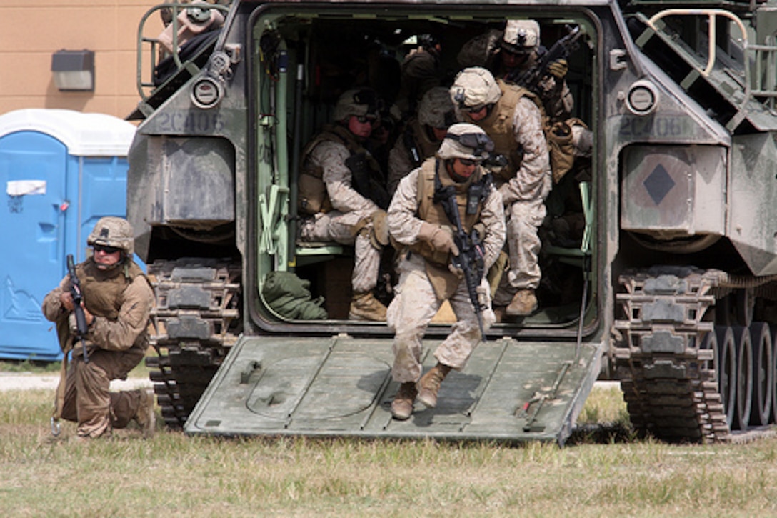 Marines from 1st Battalion / 9th Marine Regiment, Alpha Company, 2nd platoon, attached to the 24th Marine Expeditionary Unit, practice on loading and off loading Armored Assault Vehicles during the mechanized raid course aboard Camp Lejeune, NC. This training evolution will prepare these Marines for when these vehicles are used while deployed with the 24th MEU. (U.S. Marine Corps photo by LCpl David Beall)