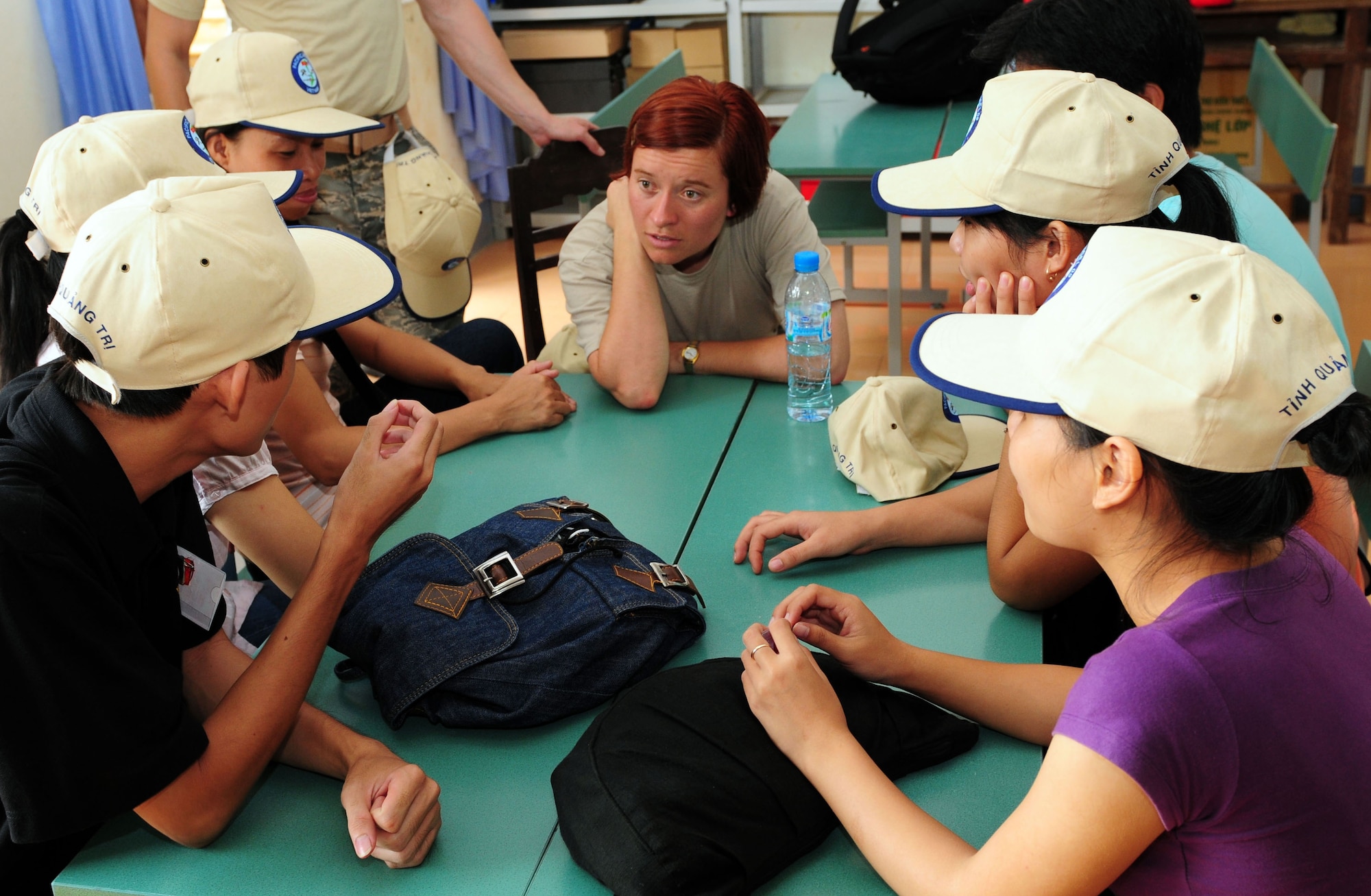 Staff Sgt. Katrina Young listens as Vietnamese translators share home medical remedies Sept. 16 in Quang Tri Province, Vietnam. Sergeant Young, a medic from the 374th Medial Group at Yokota Air Base, Japan, is participating in Operation Pacific Angel 2009.  U.S. military members are in Vietnam Sept. 15-24 to provide humanitarian assistance in cooperation with local authorities to Quang Tri Province residents. Pacific Angel is a Pacific Air Forces operation led by 13th Air Force at Hickam Air Force Base, Hawaii.  The joint and combined humanitarian assistance operation is conducted in the Pacific area of responsibility to support U.S. Pacific Command’s capacity-building efforts. (U.S. Air Force photo/Tech. Sgt. Kerry Jackson)