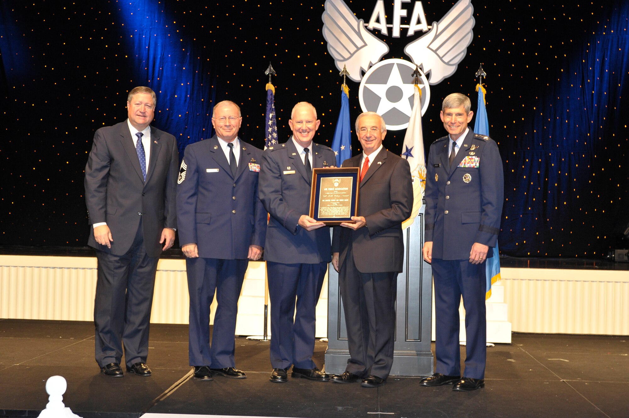 Lt. Col. Alan Sierichs (third from left), the United States Air Force Band commander, accepts the Gill Robb Wilson Award from Air Force Association Chairman of the Board Joseph Sutter Sept. 14, 2009, during the Air Force Association Air and Space Conference and Technology Exposition in Washington, D.C. The award is presented annually to an Air Force unit for outstanding contributions to national defense in the field of arts and letters. Also pictured (left to right) are: Secretary of the Air Force Michael Donley, Air Force Band Manager Chief Master Sergeant Jerry Thomas Jr. and Air Force Chief of Staff Gen. Norton Schwartz. (U.S. Air Force photo/Michael J. Pausic)