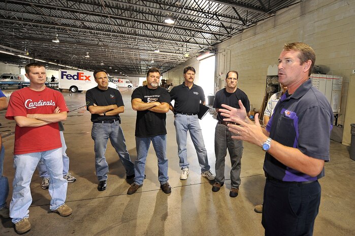 John Devereux gives the 437th Aerial Port Squadron's Lean Event Team a briefing on daily operations at a FedEx facility in North Charleston Sept. 9. The Lean Event Team visited the facility as part of an Air Force Smart Operations for the 21st Century initiative to stream line 437 APS workflow. Mr. Devereux is a manager of station operations for FedEx. (U.S. Air Force photo by James M. Bowman)