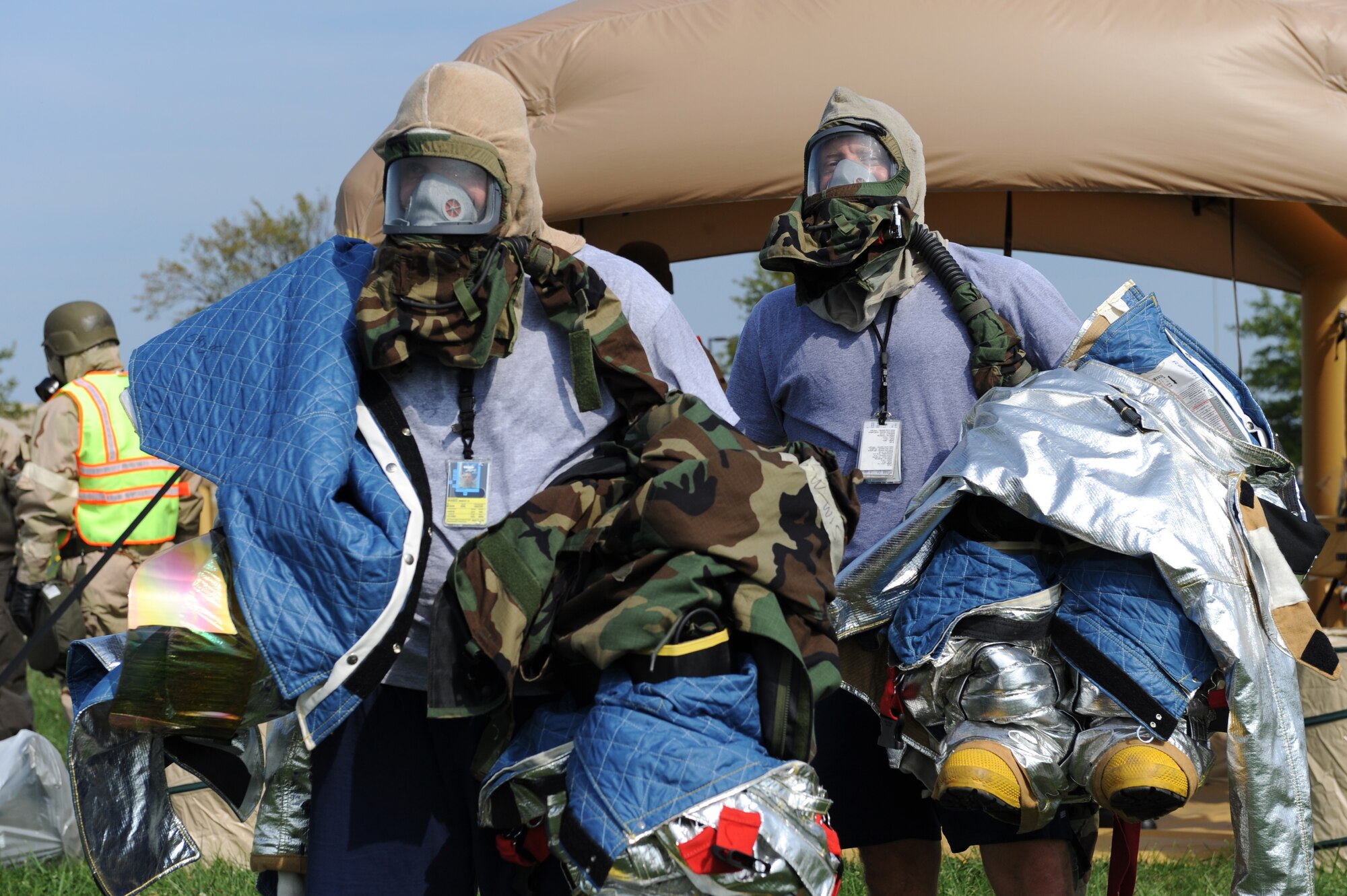 WHITEMAN AIR FORCE BASE, Mo. – Technical Sergeant Charles Roush and Staff Sergeant Brent Hanson, 442nd Fighter Wing, hold all of their gear waiting to proceed further through the chemical line, Sept. 16. The 442nd Fighter Wing has exercise to ensure their members remain current on their readiness training. (U.S. Air Force Photo/ SrA Cory Todd)