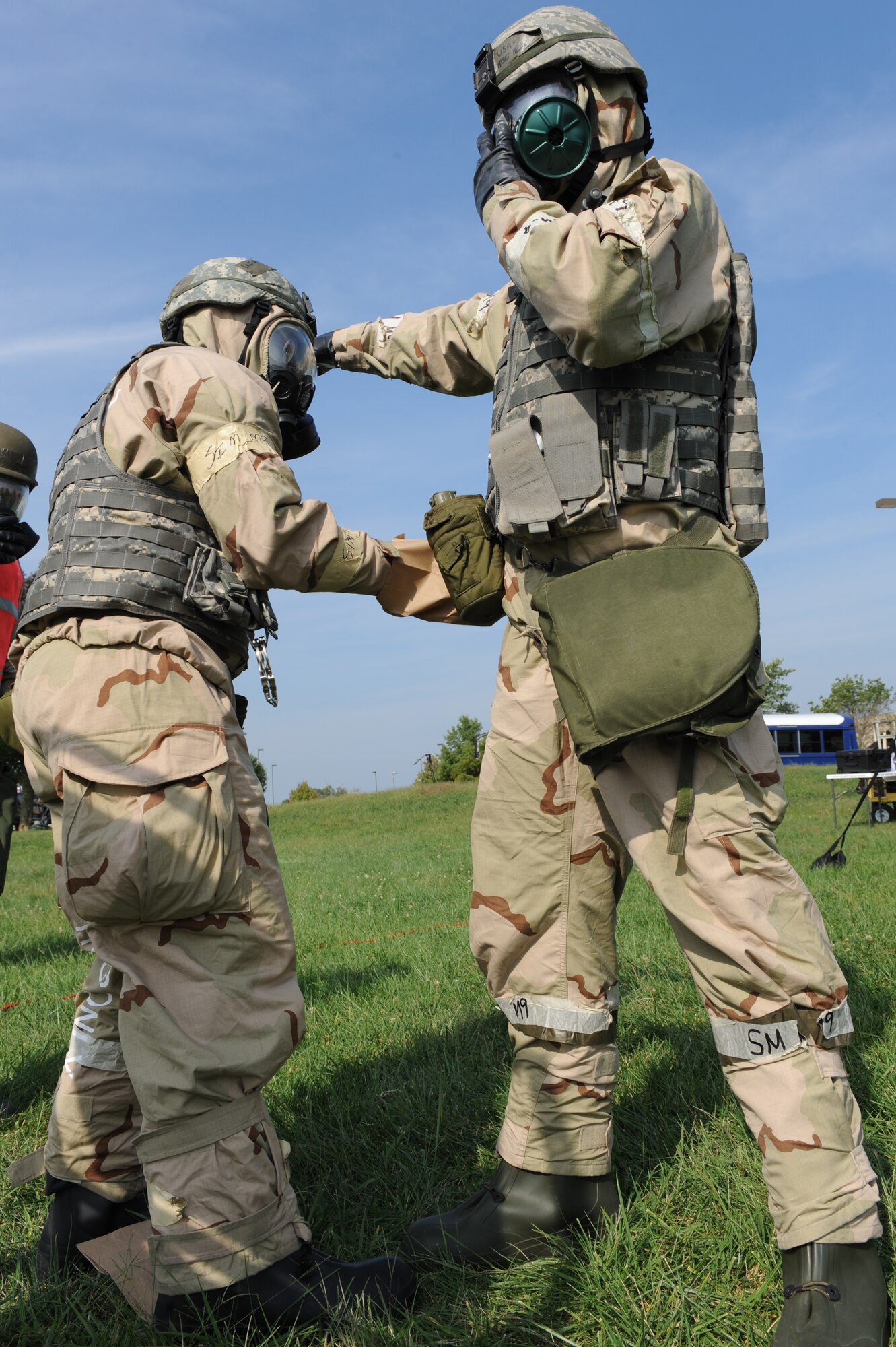 WHITEMAN AIR FORCE BASE, Mo. – Members of the 442nd Fighter Wing decontaminates each other while processing through a chemical line during an exercise, Sept. 16. The 442nd Fighter Wing has exercise to ensure their members remain current on their readiness training. (U.S. Air Force Photo/ SrA Cory Todd)