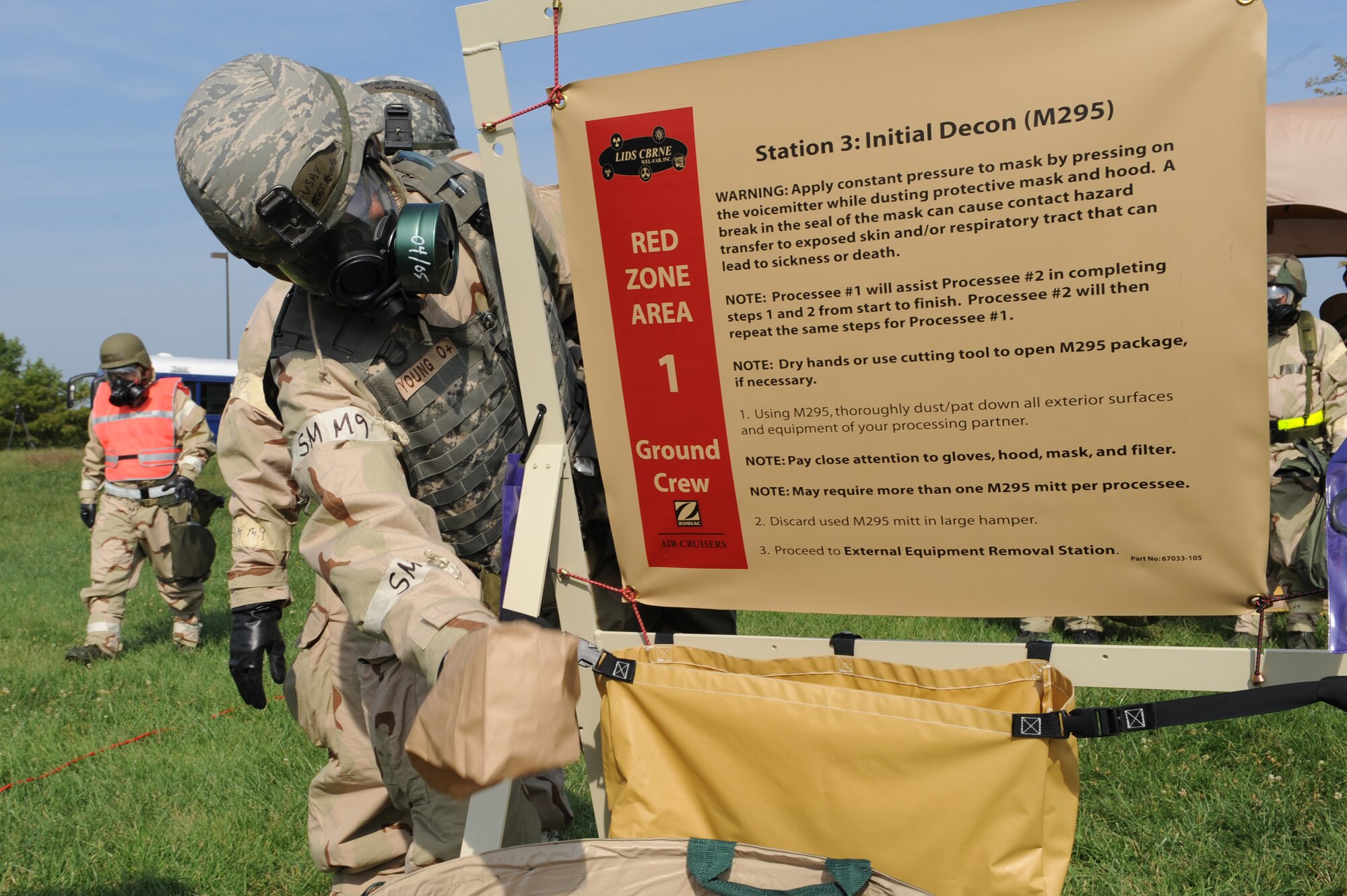 WHITEMAN AIR FORCE BASE, Mo. – a member of the 442nd Fighter Wing throws away a contaminated paper bag while possessing through a chemical line during an exercise, Sept. 16. The 442nd Fighter Wing has exercise to ensure their members remain current on their readiness training. (U.S. Air Force Photo/ SrA Cory Todd)